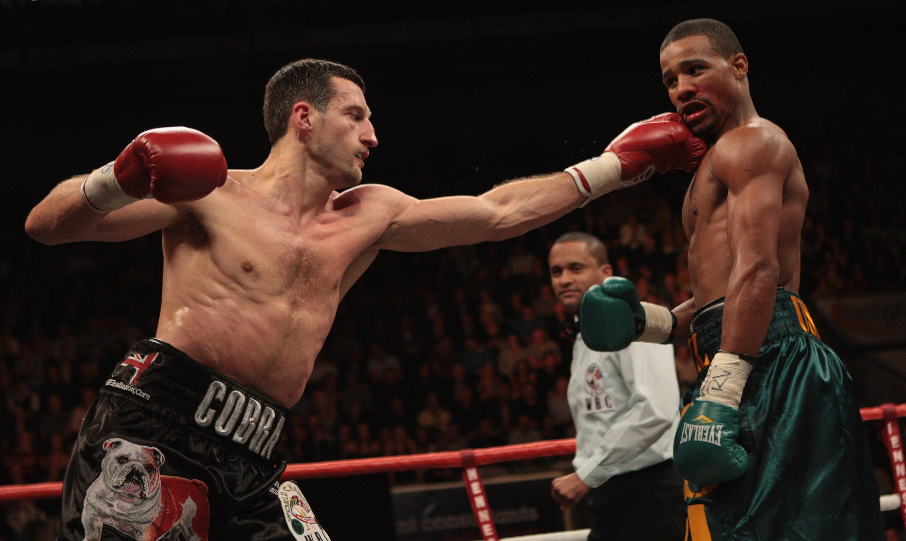 NOTTINGHAM, ENGLAND - OCTOBER 17:  Carl Froch (L) connects with a left jab as he retains his title against Andre Dirrell during their WBC Super Middleweight fight on October 17, 2009 at Trent FM Arena in Nottingham, England.  (Photo by John Gichigi/Getty