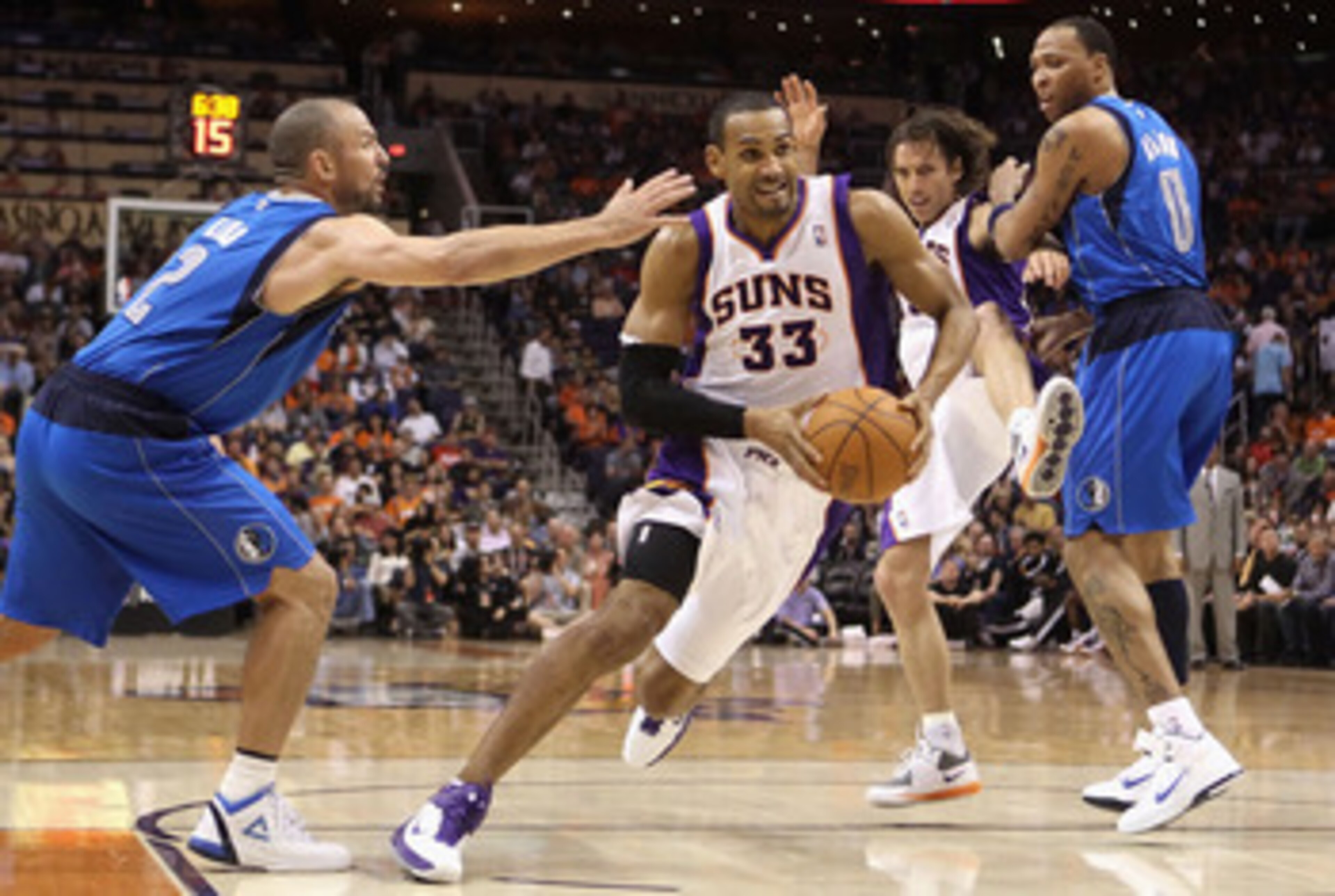 PHOENIX, AZ - MARCH 27: Grant Hill #33 of the Phoenix Suns drives the ball past Jason Kidd #2 of the Dallas Mavericks during the NBA game at US Airways Center on March 27, 2011 in Phoenix, Arizona. The Mavericks defeated the Suns 91-83. NOTE TO USER: PHOENIX, AZ - MARCH 27: Grant Hill #33 of the Phoenix Suns drives the ball past Jason Kidd #2 of the Dallas Mavericks during the NBA game at US Airways Center on March 27, 2011 in Phoenix, Arizona. The Mavericks defeated the Suns 91-83. NOTE TO USER: