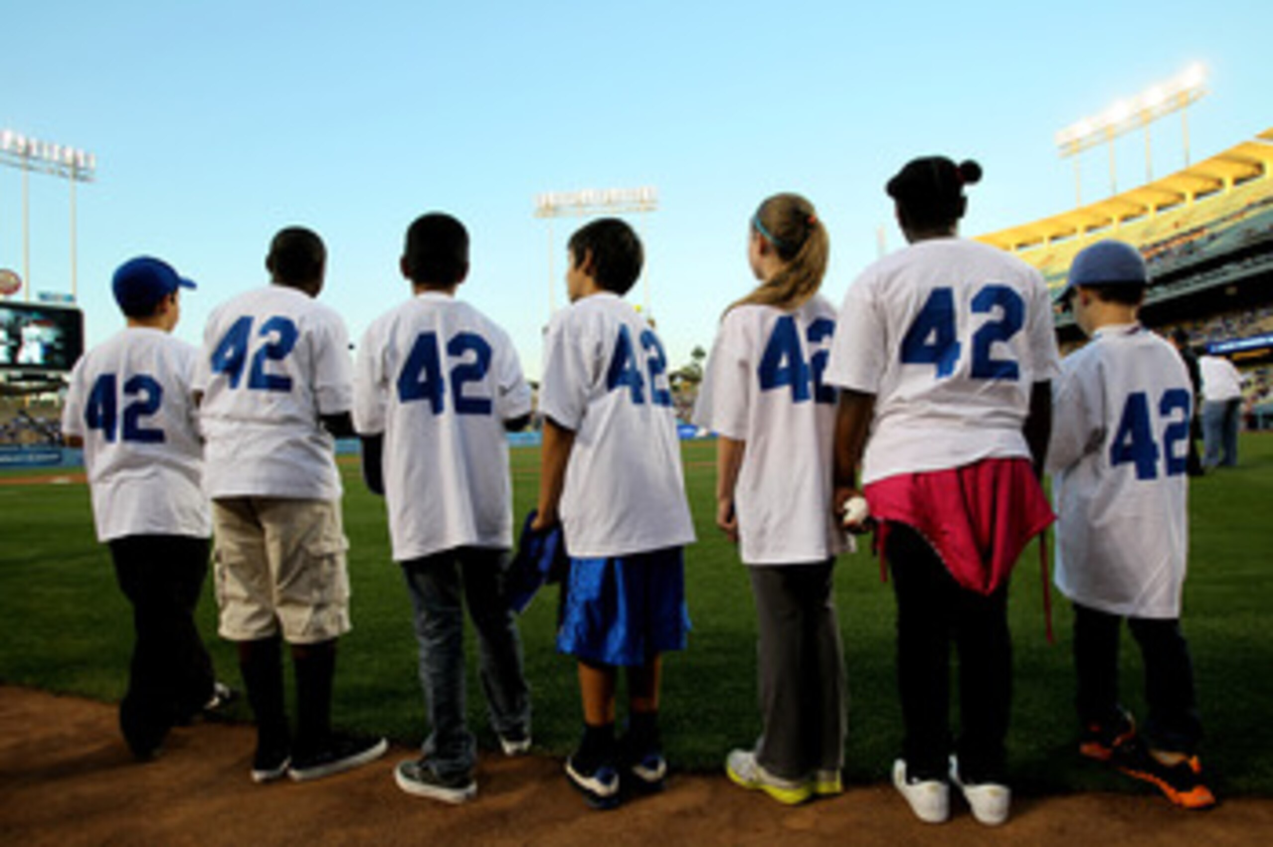 LOS ANGELES, CA - APRIL 15:  Children waiting to take part in pre game activities wear #42  before the game between the Los Angeles Dodgers and the St. Louis Cardinals as Major League Baseball celebrates Jackie Robinson Day on April 15, 2011 at Dodger Sta