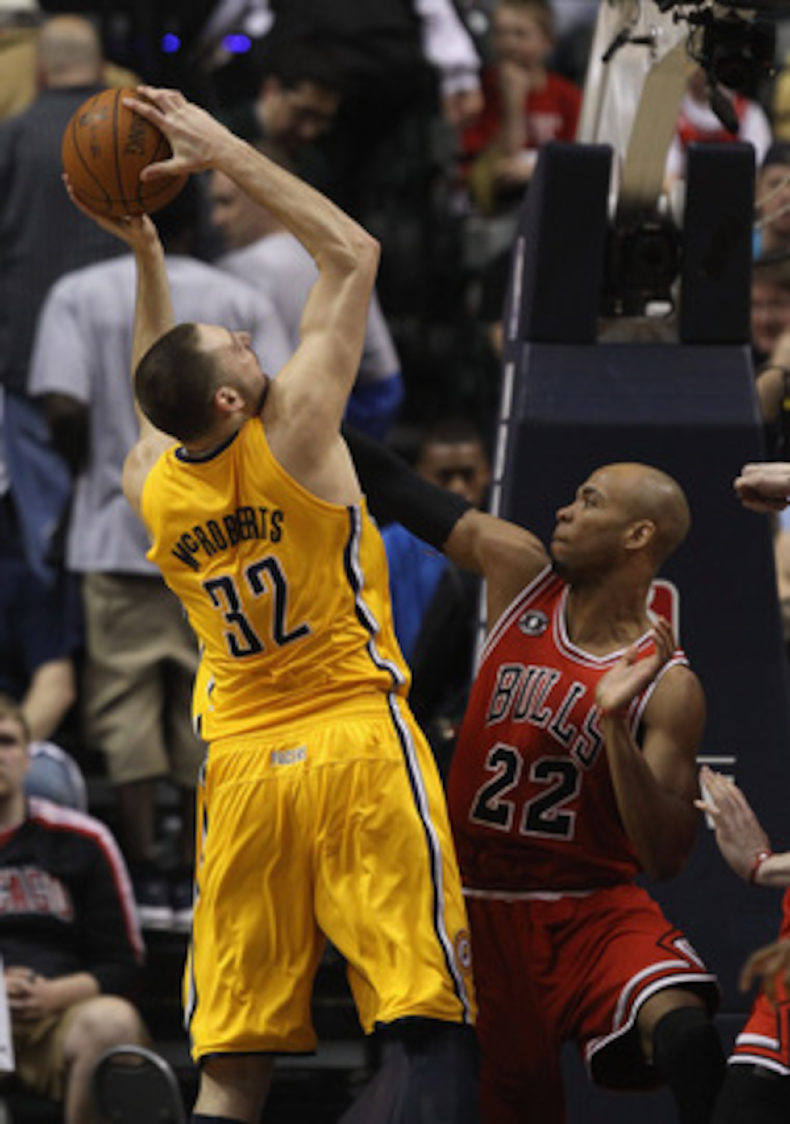 INDIANAPOLIS, IN - APRIL 23: Josh McRoberts #32 of the Indiana Pacers puts up a shot against Taj Gibson #22 of the Chicago Bulls in Game Four of the Eastern Conference Quarterfinals in the 2011 NBA Playoffs at Conseco Fieldhouse on April 23, 2011 in India