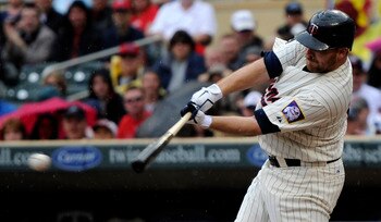 MINNEAPOLIS, MN - MAY 29: Jason Kubel #16 of the Minnesota Twins hits an RBI single against the Los Angeles Angels of Anaheim during the first inning of their game on May 29, 2011 at Target Field in Minneapolis, Minnesota. (Photo by Hannah Foslien/Getty I
