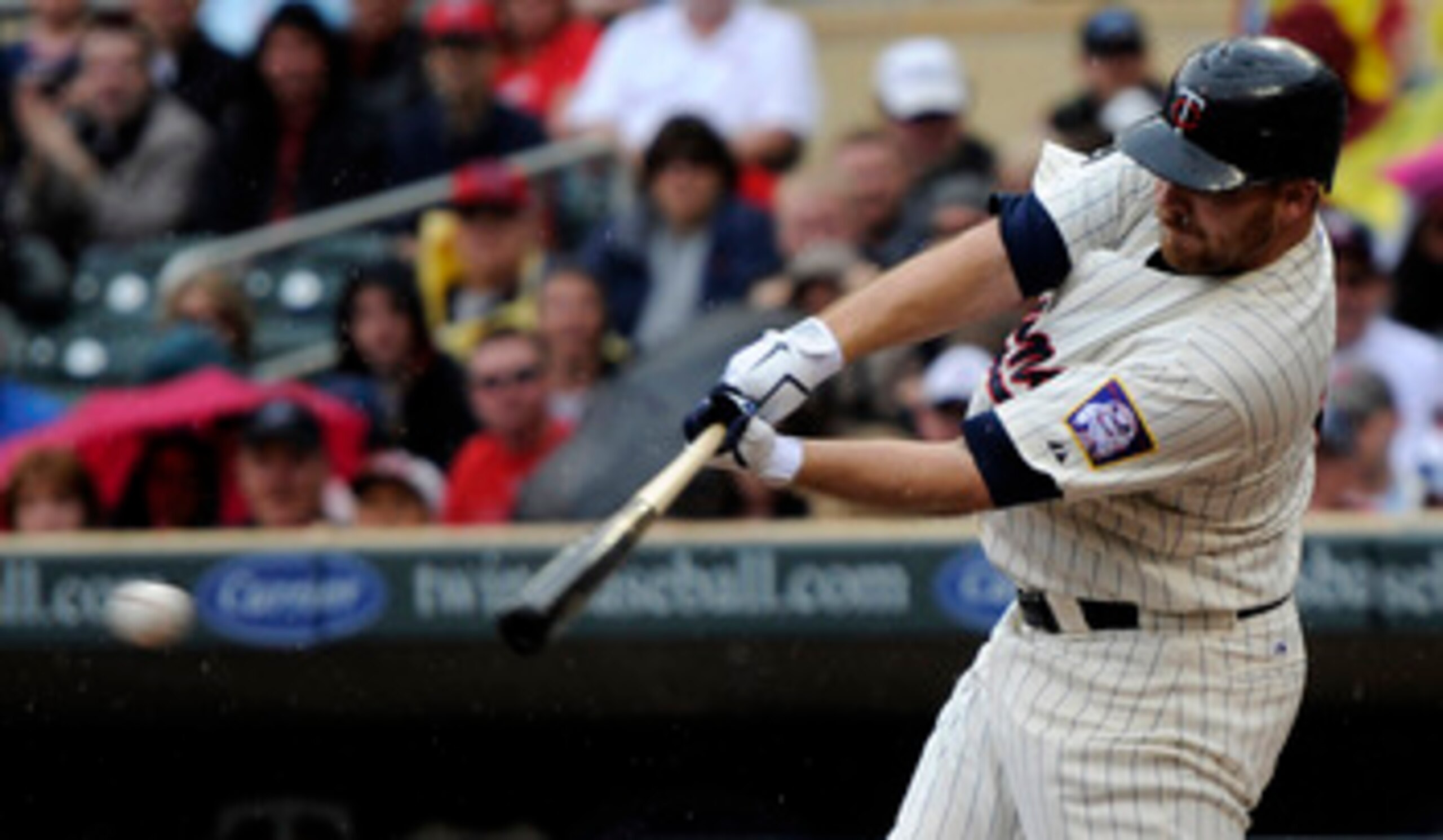 MINNEAPOLIS, MN - MAY 29: Jason Kubel #16 of the Minnesota Twins hits an RBI single against the Los Angeles Angels of Anaheim during the first inning of their game on May 29, 2011 at Target Field in Minneapolis, Minnesota. (Photo by Hannah Foslien/Getty I