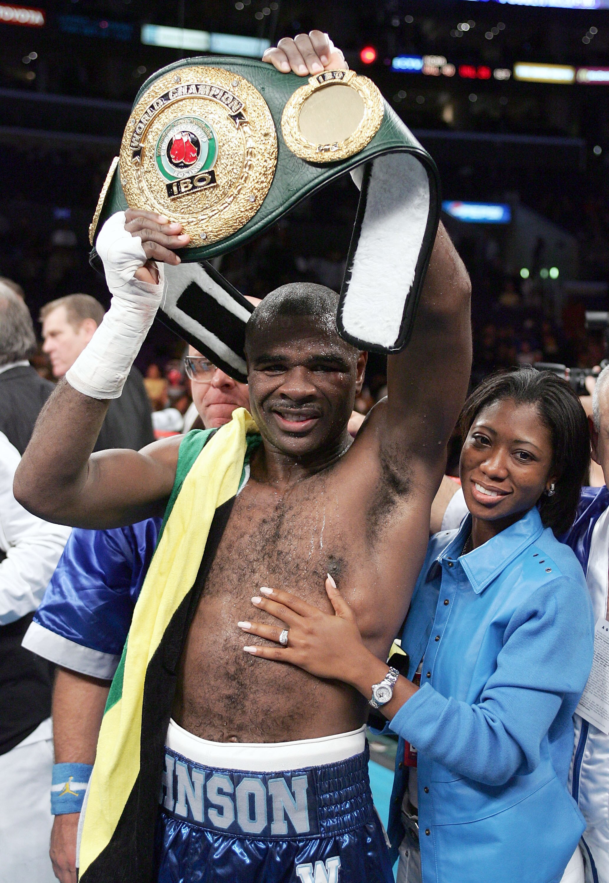 LOS ANGELES - DECEMBER 18:  Glen Johnson and wife celebrate after his split decision win over Antonio Tarver in the IBO world light heavyweight championship bout on December 18, 2004 at Staples Center in Los Angeles, California.  (Photo by Robert Laberge/