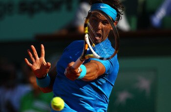 PARIS, FRANCE - JUNE 01:  Rafael Nadal of Spain hits a backhand during the men's singles quarterfinal match between Rafael Nadal of Spain and Robin Soderling of Sweden on day eleven of the French Open at Roland Garros on June 1, 2011 in Paris, France.  (P
