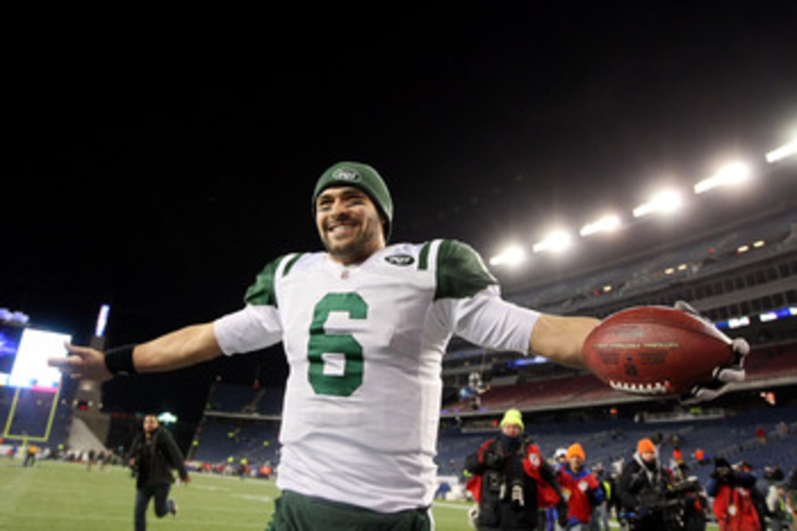FOXBORO, MA - JANUARY 16:  Mark Sanchez #6 of the New York Jets celebrates after the Jets defeated the Patriots 28 to 21 in their 2011 AFC divisional playoff game at Gillette Stadium on January 16, 2011 in Foxboro, Massachusetts.  (Photo by Al Bello/Getty