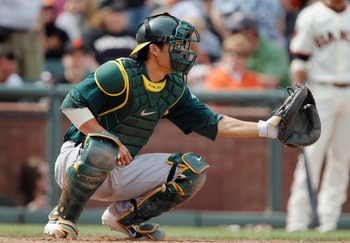 SAN FRANCISCO, CA - MAY 22:  Catcher Kurt Suzuki #8 of the Oakland A's catches against the San Francisco Giants at AT&T Park on May 22, 2011 in San Francisco, California.  The Giants won 5-4.  (Photo by Brian Bahr/Getty Images)