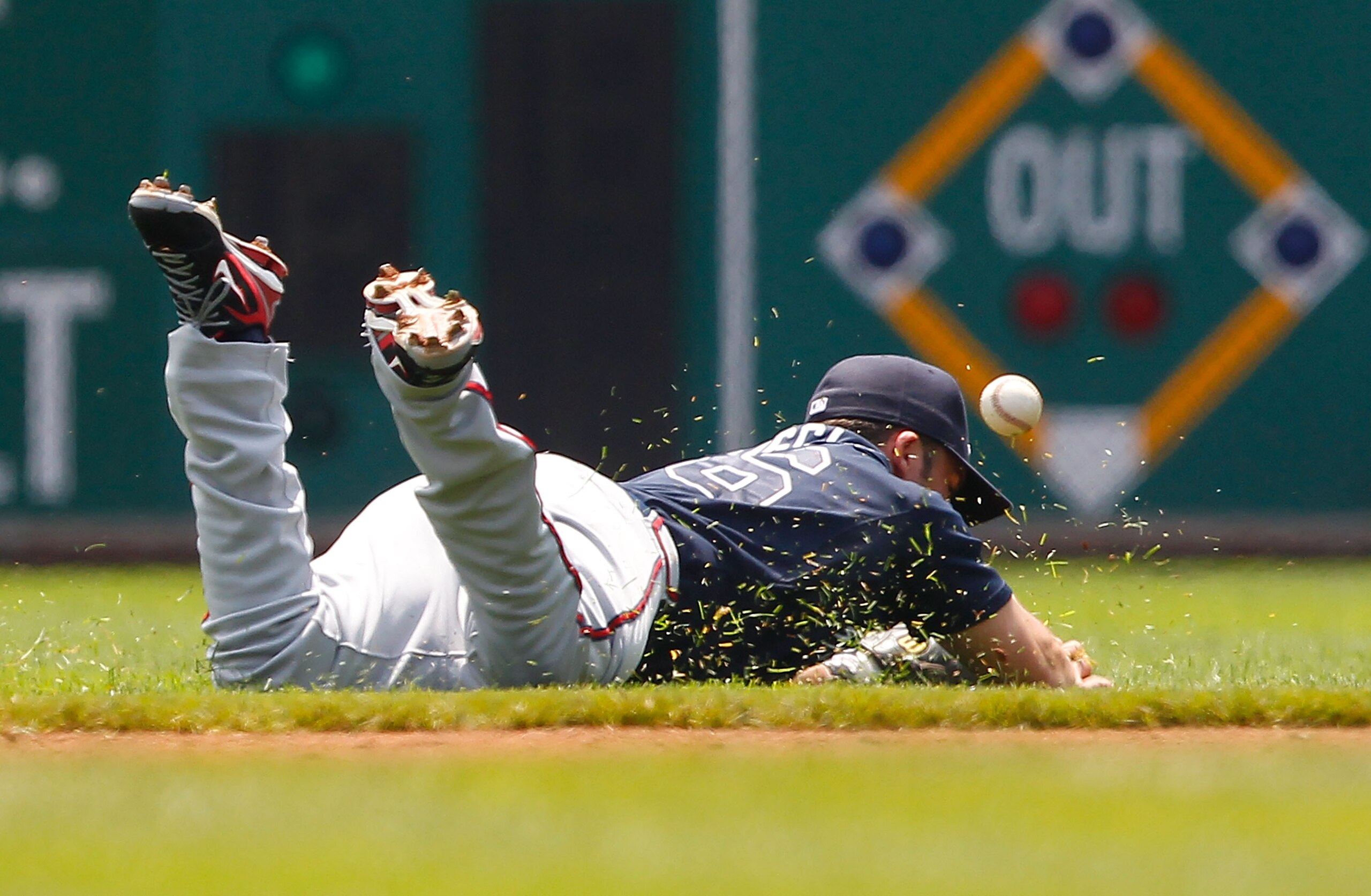 PITTSBURGH - MAY 25: Dan Uggla #26 of the Atlanta Braves misplays a ball in the infield during the game against the Pittsburgh Pirates on May 25, 2011 at PNC Park in Pittsburgh, Pennsylvania. (Photo by Jared Wickerham/Getty Images) PITTSBURGH - MAY 25: Dan Uggla #26 of the Atlanta Braves misplays a ball in the infield during the game against the Pittsburgh Pirates on May 25, 2011 at PNC Park in Pittsburgh, Pennsylvania. (Photo by Jared Wickerham/Getty Images)