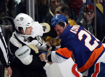 UNIONDALE, NY - APRIL 08:  Arron Asham #45 of the Pittsburgh Penguins fights with Zenon Konopka #28 of the New York Islanders in the first period at the Nassau Coliseum on April 8, 2011 in Uniondale, New York.  (Photo by Bruce Bennett/Getty Images)