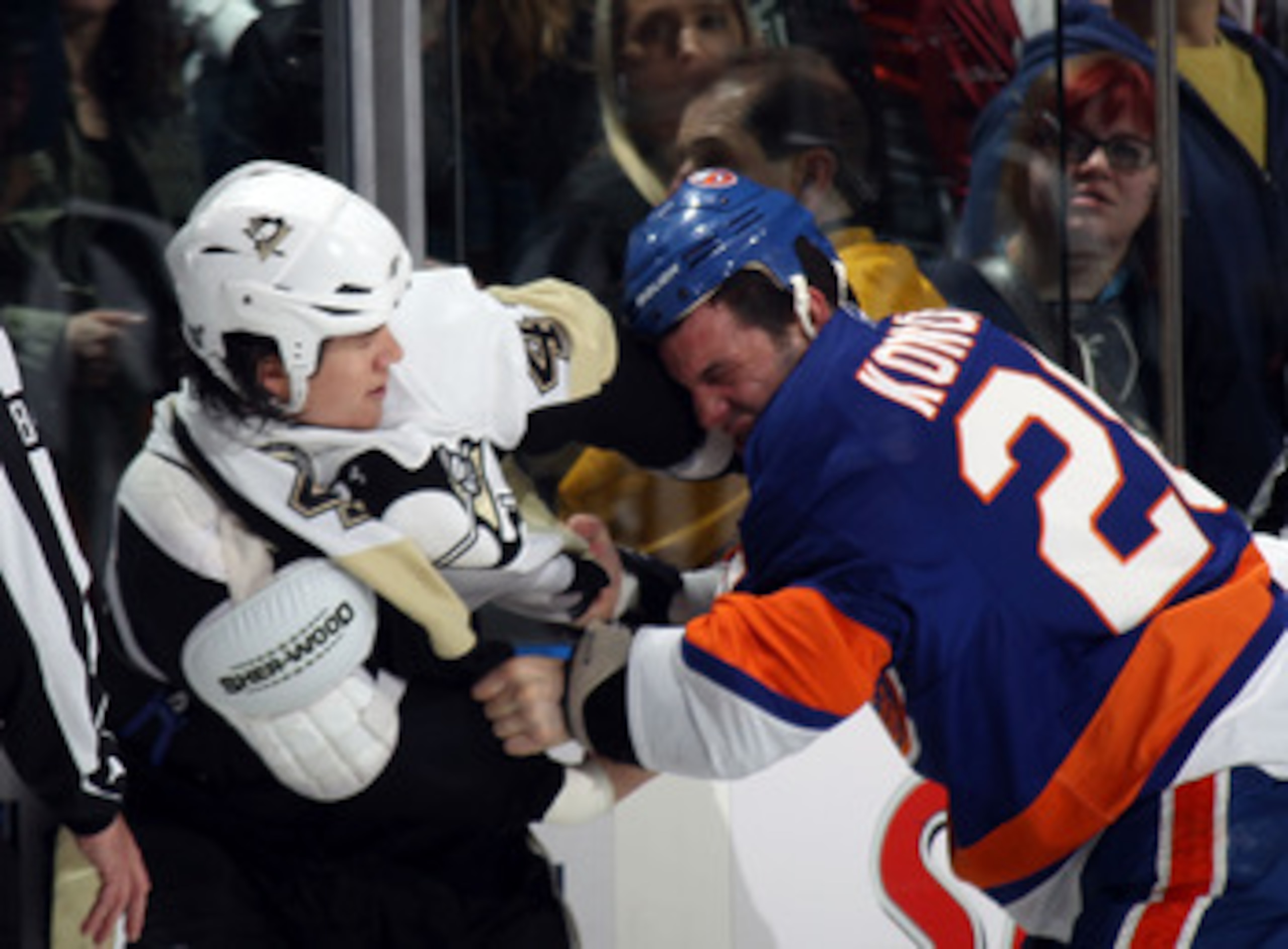 UNIONDALE, NY - APRIL 08:  Arron Asham #45 of the Pittsburgh Penguins fights with Zenon Konopka #28 of the New York Islanders in the first period at the Nassau Coliseum on April 8, 2011 in Uniondale, New York.  (Photo by Bruce Bennett/Getty Images)