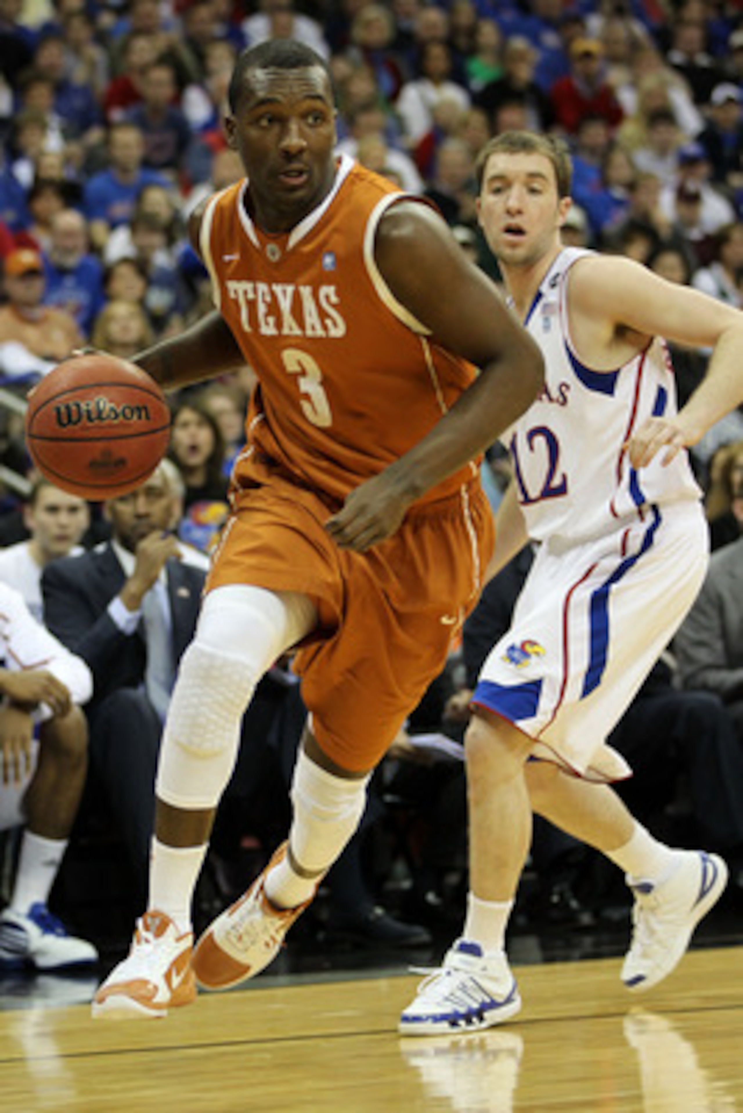 KANSAS CITY, MO - MARCH 12:  Jordan Hamilton #3 of the Texas Longhorns drives with the ball against the Kansas Jayhawks during the 2011 Phillips 66 Big 12 Men's Basketball Tournament championship game at Sprint Center on March 12, 2011 in Kansas City, Mis