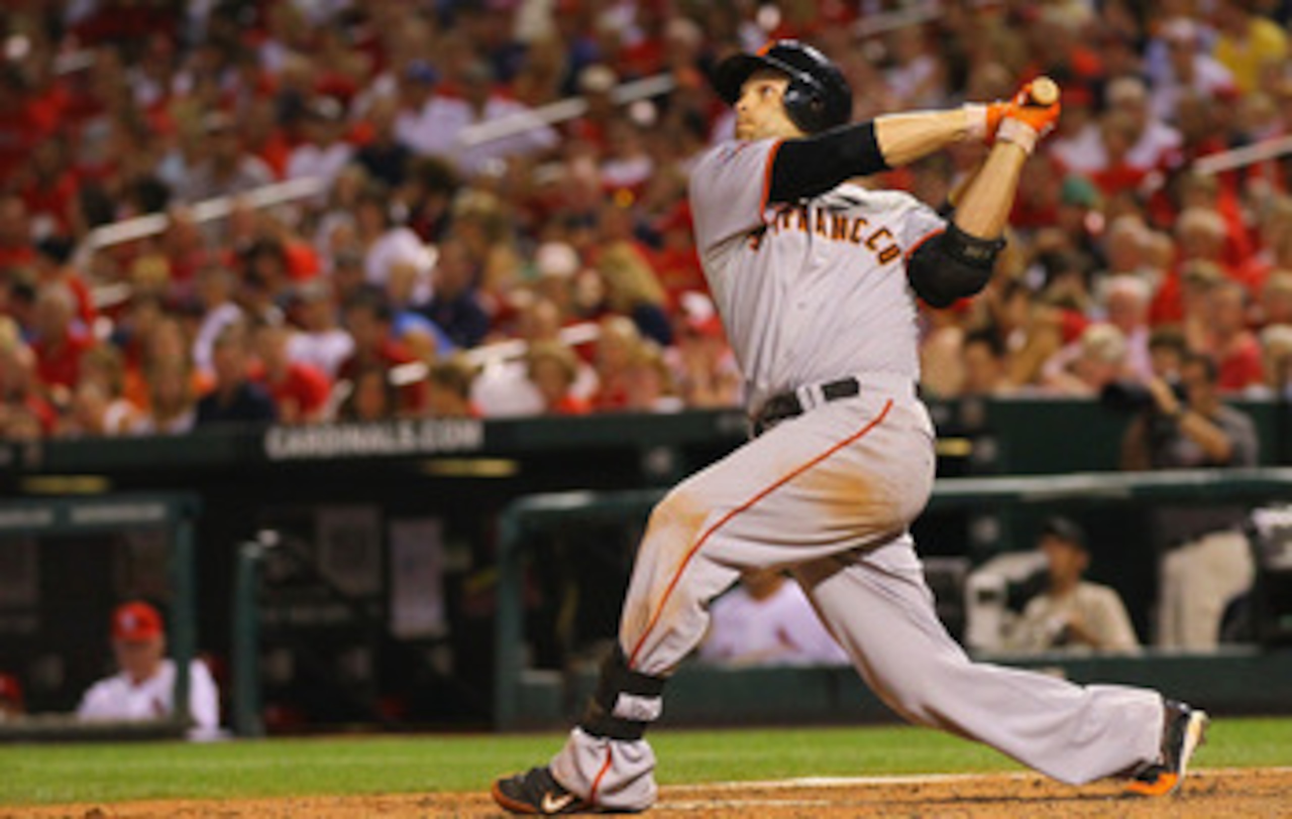 ST. LOUIS, MO - JUNE 2: Freddy Sanchez #21 of the San Francisco Giants hits a three-run home run against the St. Louis Cardinals at Busch Stadium on June 2, 2011 in St. Louis, Missouri.  (Photo by Dilip Vishwanat/Getty Images)