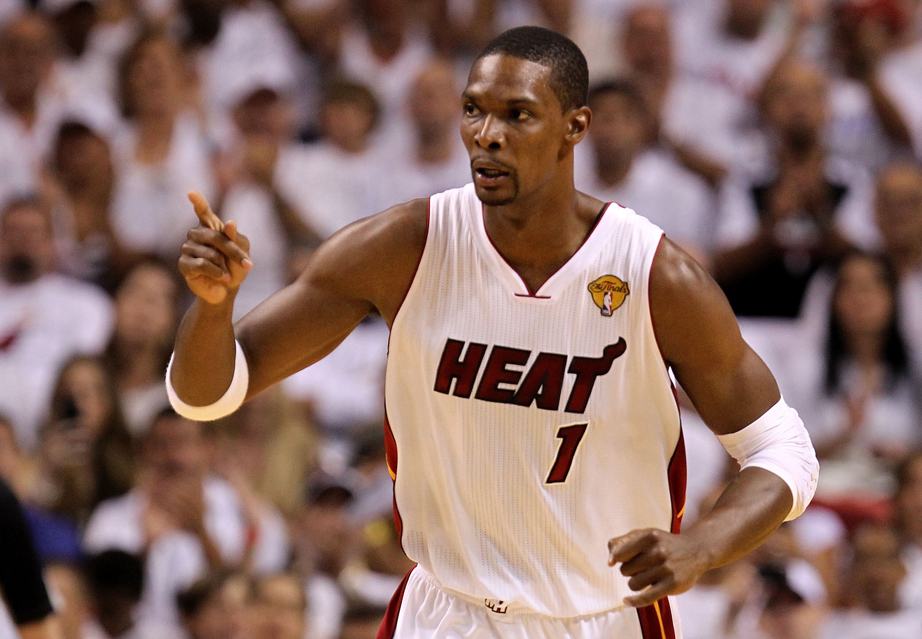 MIAMI, FL - JUNE 02:  Chris Bosh #1 of the Miami Heat reacts against the Dallas Mavericks
in the first quarter of Game Two of the 2011 NBA Finals at American Airlines Arena on June 2, 2011 in Miami, Florida. NOTE TO USER: User expressly acknowledges and a