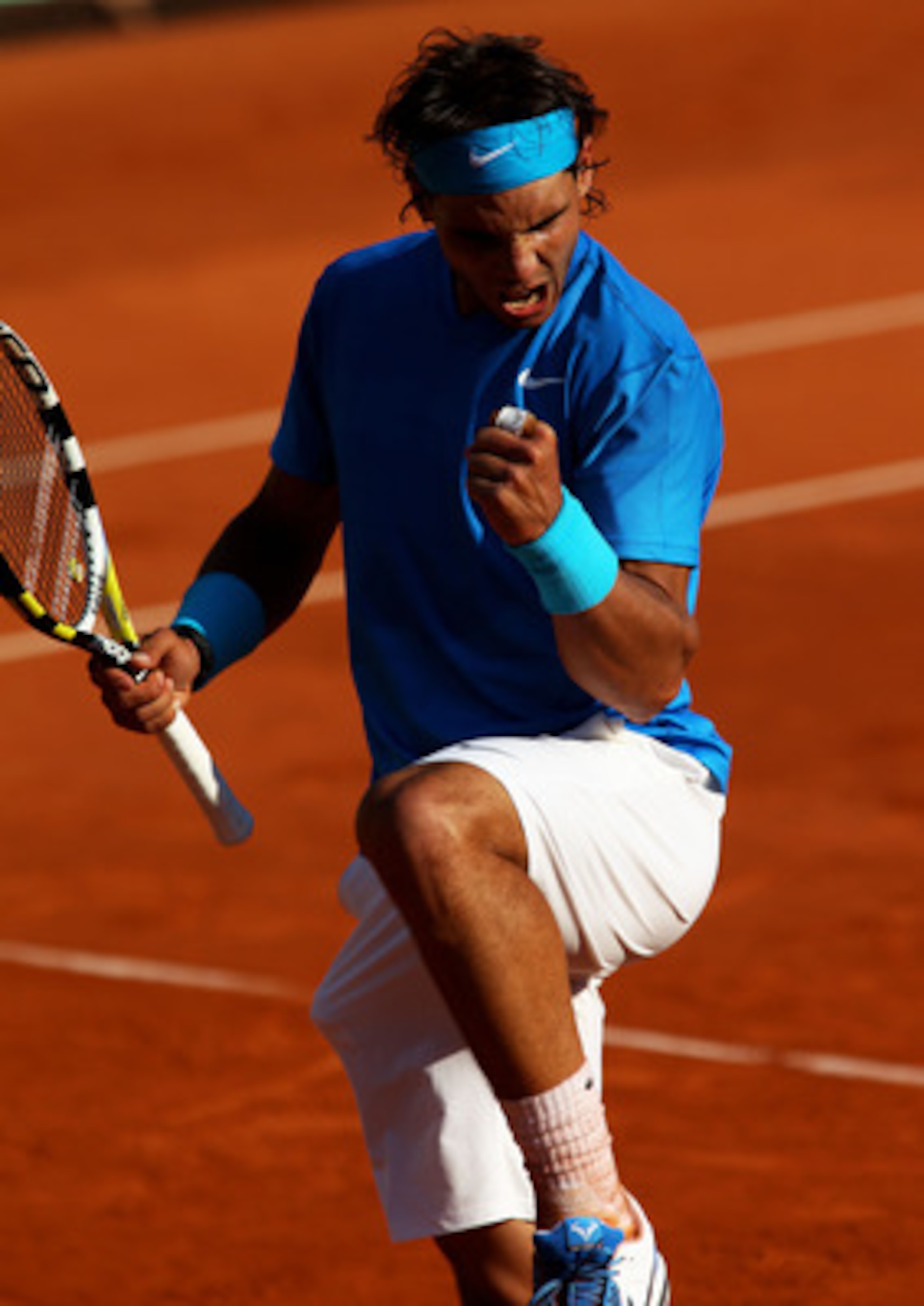 PARIS, FRANCE - JUNE 01:  Rafael Nadal of Spain celebrates a point during the men's singles quarterfinal match between Rafael Nadal of Spain and Robin Soderling of Sweden on day eleven of the French Open at Roland Garros on June 1, 2011 in Paris, France.