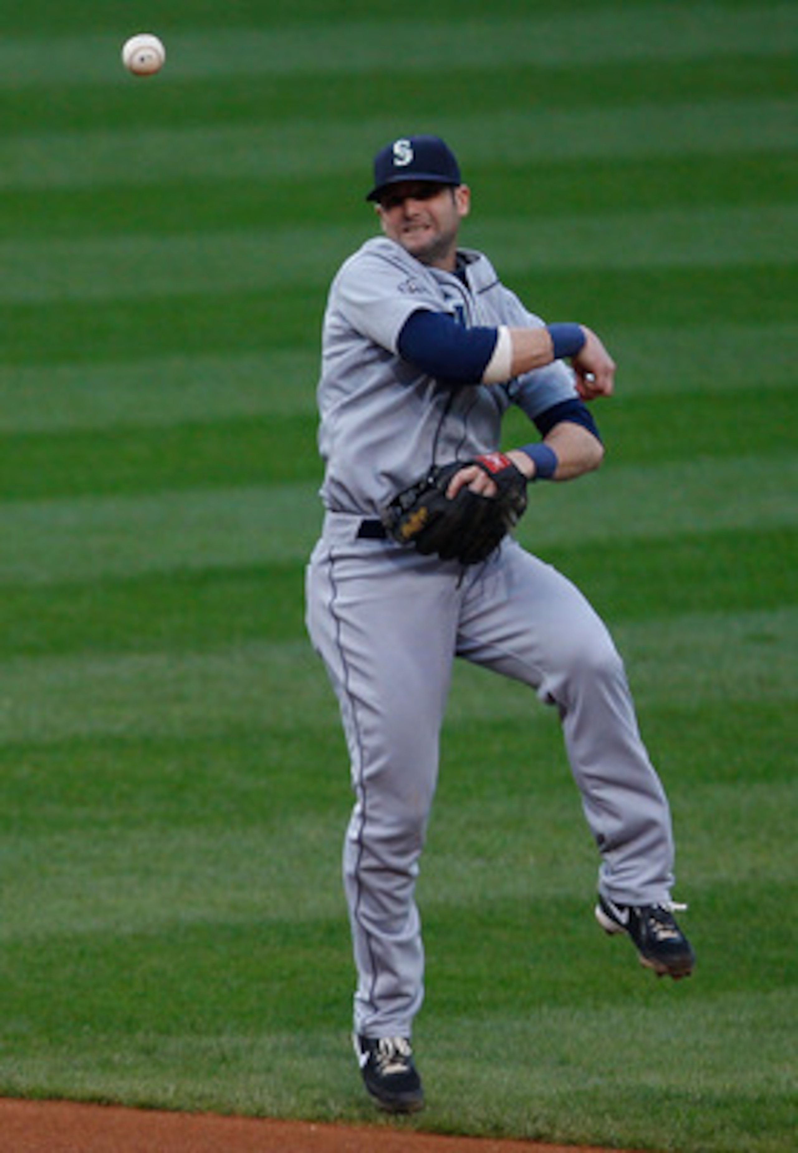 CLEVELAND - MAY 13: Adam Kennedy #4 of the Seattle Mariners turns and throws to first base against  the Cleveland Indians during the game on May 13, 2011 at Progressive Field in Cleveland, Ohio.  (Photo by Jared Wickerham/Getty Images)