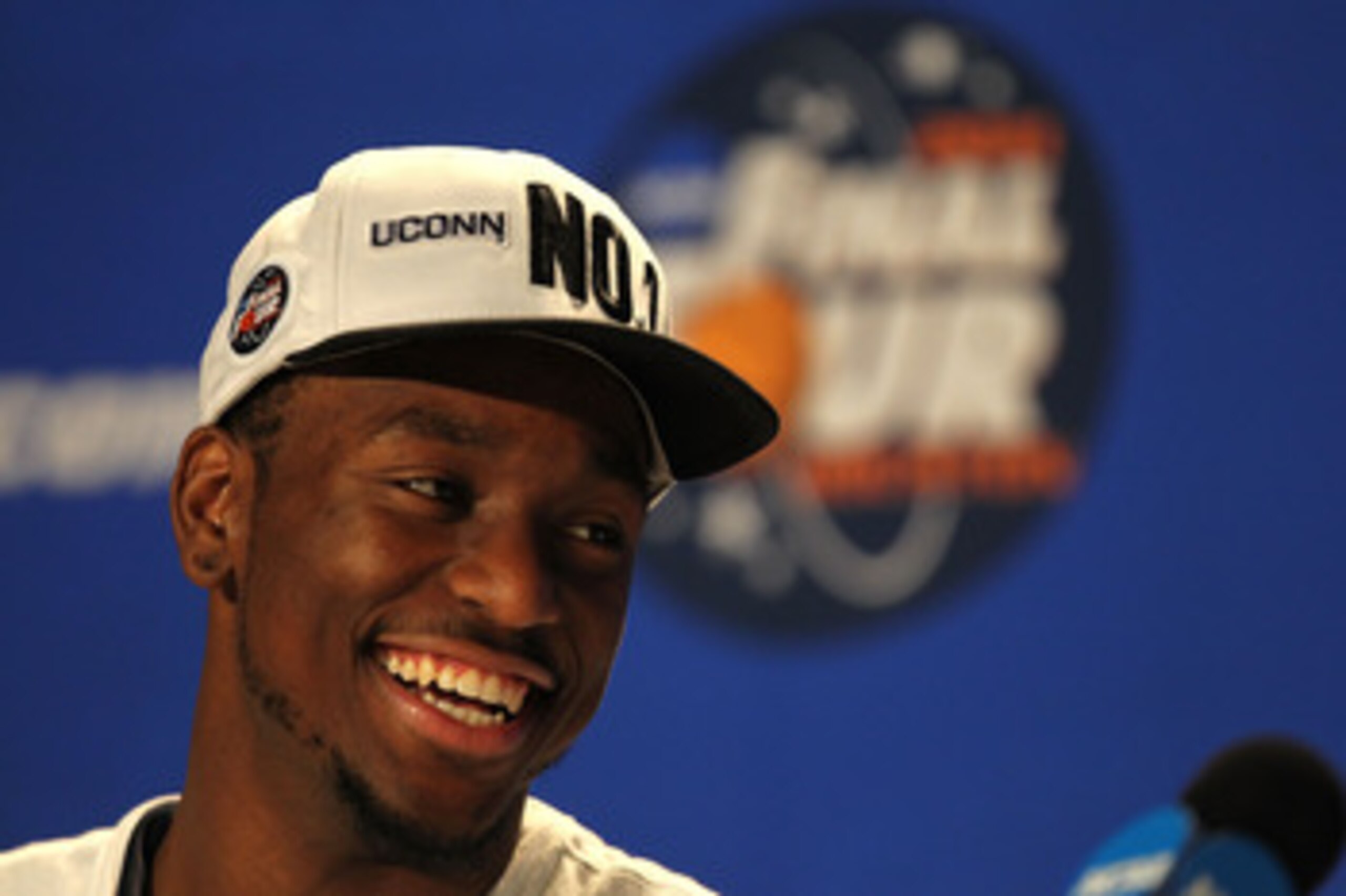 HOUSTON, TX - APRIL 04:  Kemba Walker #15 of the Connecticut Huskies speaks to the media after defeating the Butler Bulldogs to win the National Championship Game of the 2011 NCAA Division I Men's Basketball Tournament at Reliant Stadium on April 4, 2011