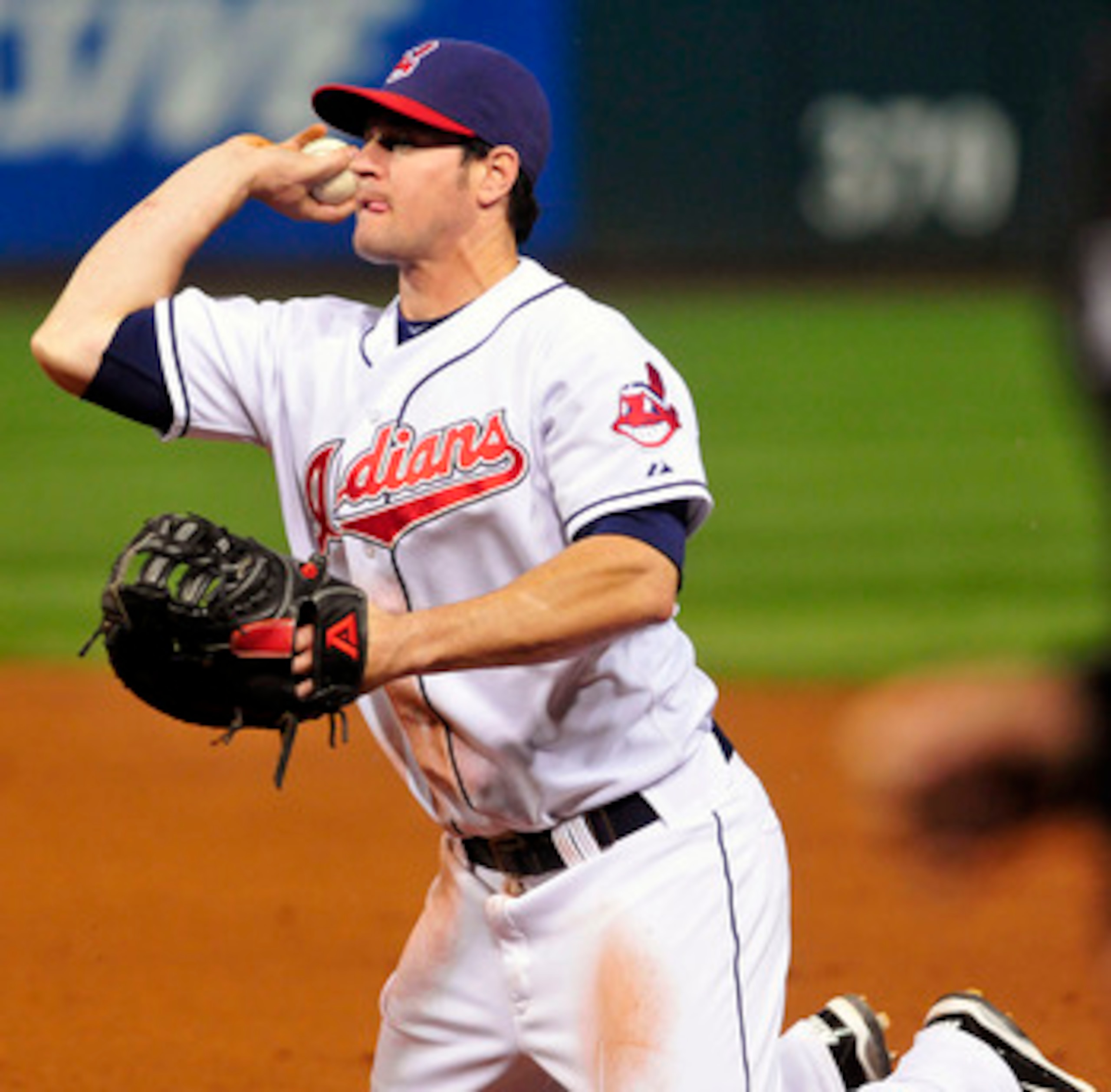 CLEVELAND, OH - JUNE 2: Matt LaPorta #7 of the Cleveland Indians fields aground ball from Josh Hamilton #32 of the Texas Rangers (not shown) during the ninth inning at Progressive Field on June 2, 2011 in Cleveland, Ohio. The Texas Rangers beat the Clevel