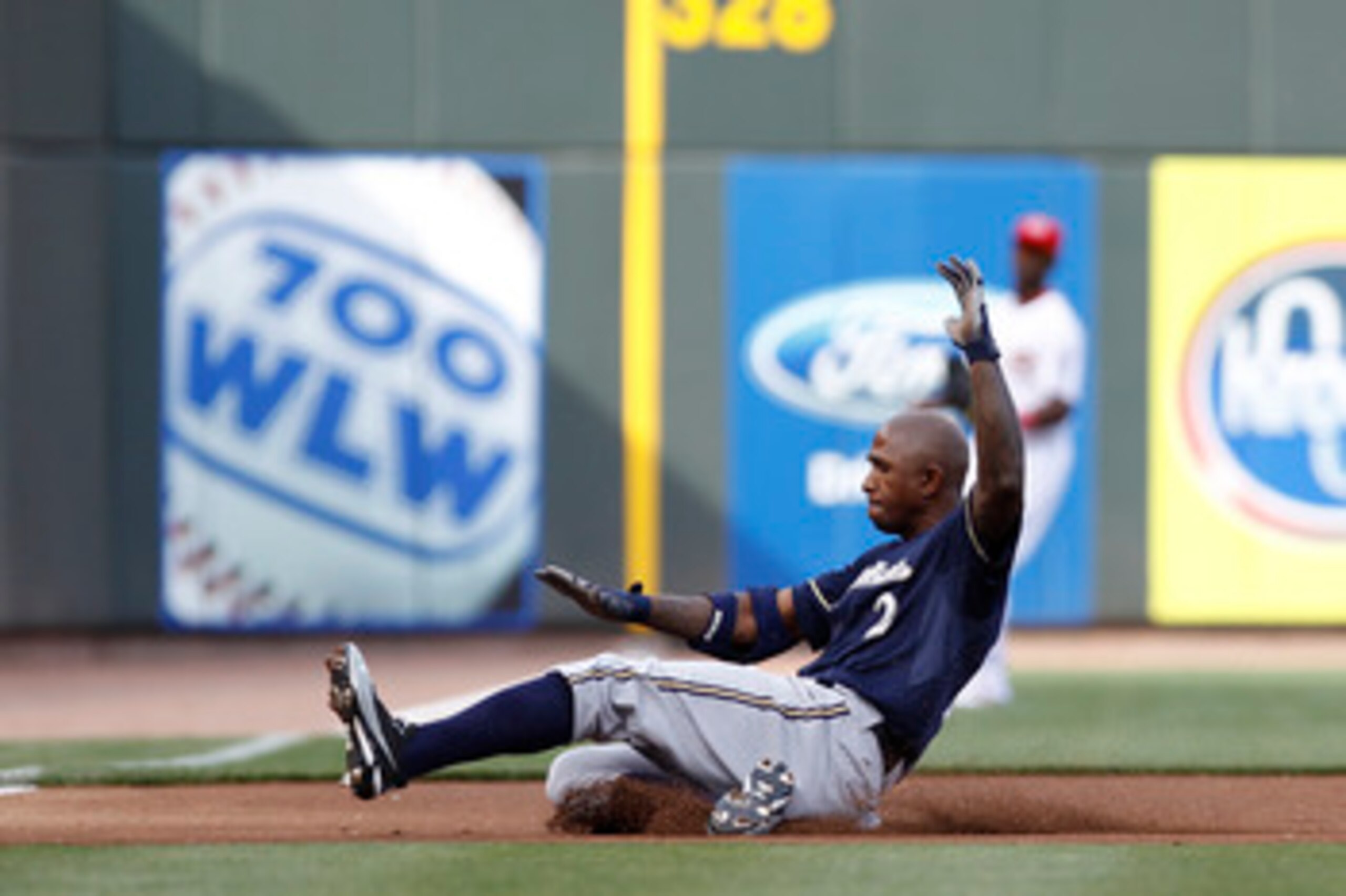 CINCINNATI, OH - JUNE 1: Nyjer Morgan #2 of the Milwaukee Brewers slides into third base with a triple in the first inning against the Cincinnati Reds at Great American Ball Park on June 1, 2011 in Cincinnati, Ohio. (Photo by Joe Robbins/Getty Images)