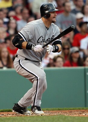 BOSTON, MA - MAY 30:  A.J. Pierzynski #12 of the Chicago White Sox hits a 2RBI single in the first inning against the Boston Red Sox on May 30, 2011 at Fenway Park in Boston, Massachusetts.  (Photo by Elsa/Getty Images)