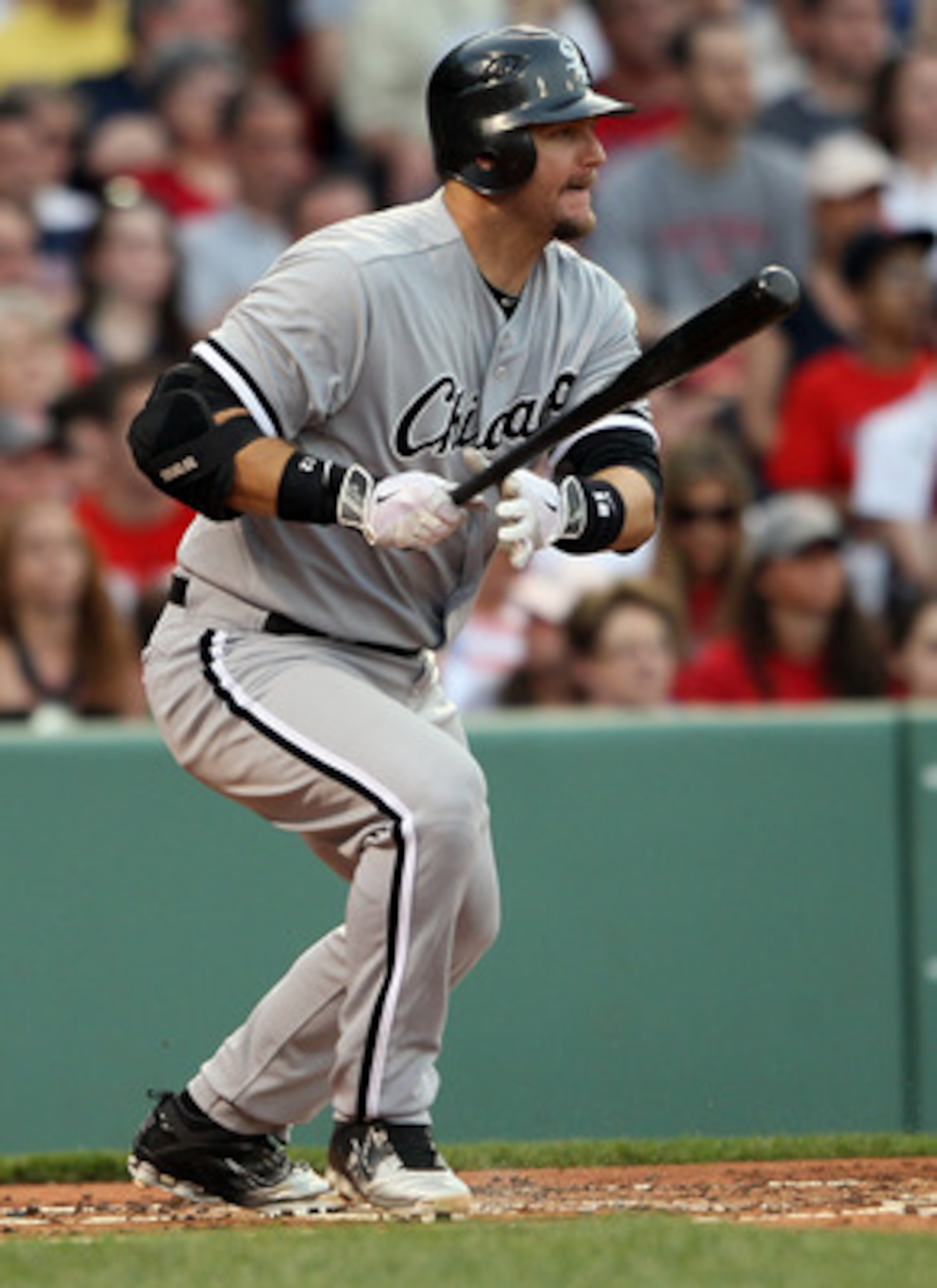 BOSTON, MA - MAY 30:  A.J. Pierzynski #12 of the Chicago White Sox hits a 2RBI single in the first inning against the Boston Red Sox on May 30, 2011 at Fenway Park in Boston, Massachusetts.  (Photo by Elsa/Getty Images)