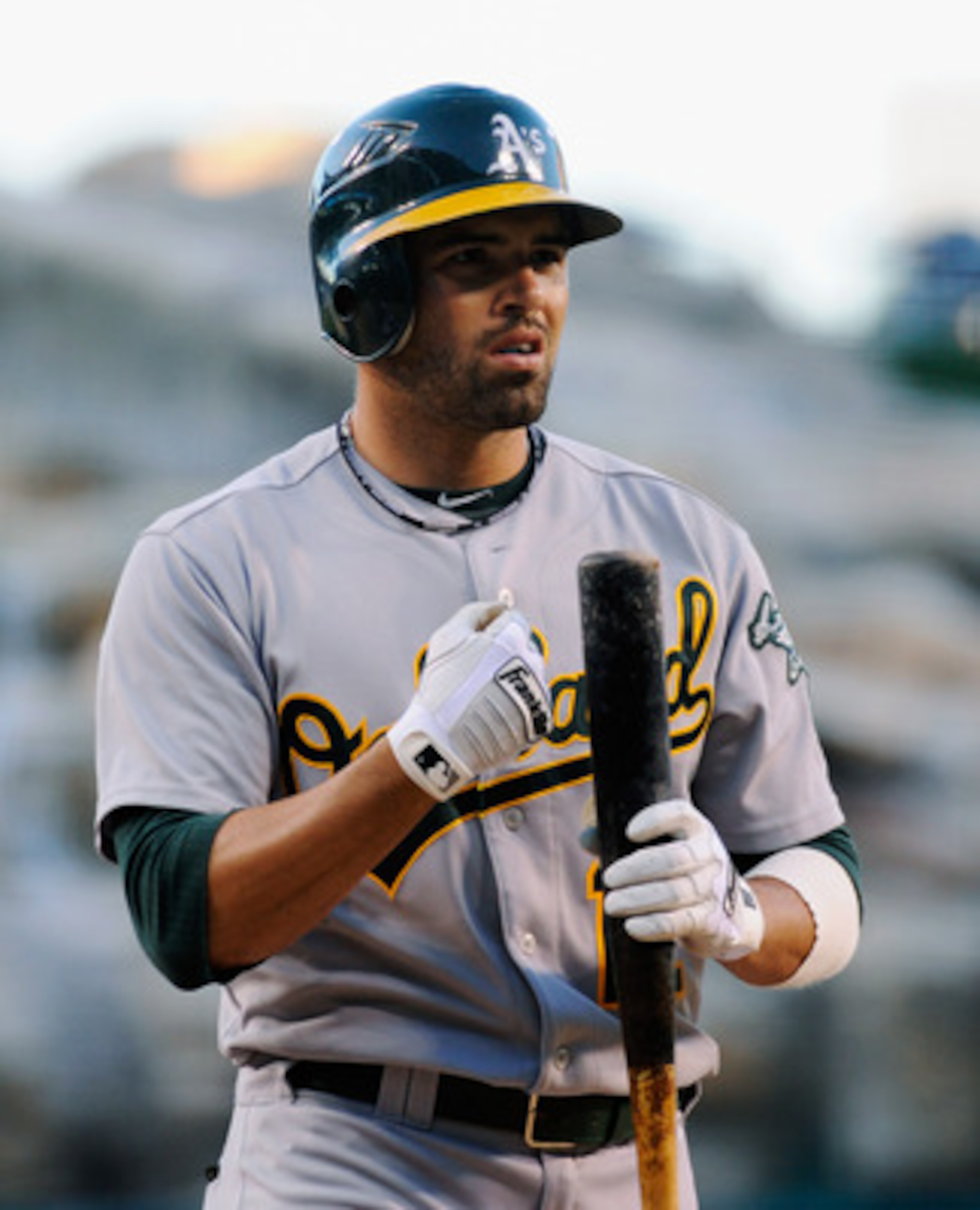 ANAHEIM, CA - MAY 25:  David DeJesus #12 of the Oakland Athletics at bat against the Los Angeles Angels of Anaheim during the baseball game at Angel Stadium of Anaheim on May 25, 2011 in Anaheim, California.  (Photo by Kevork Djansezian/Getty Images)