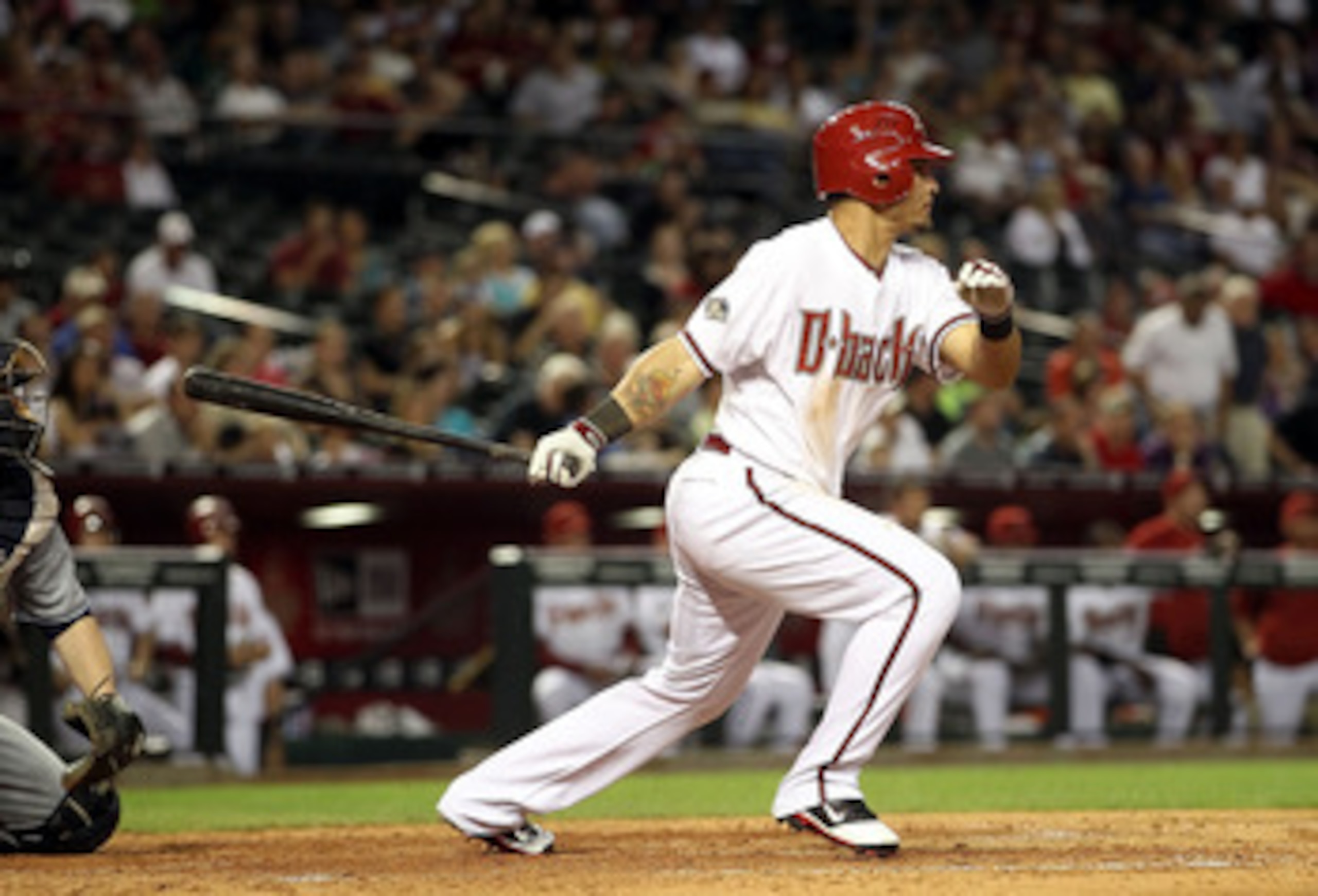 PHOENIX, AZ - MAY 17:  Gerardo Parra #8 of the Arizona Diamondbacks hits a two RBI single against the San Diego Padres during the sixth inning of the Major League Baseball game at Chase Field on May 17, 2011 in Phoenix, Arizona.  (Photo by Christian Peter