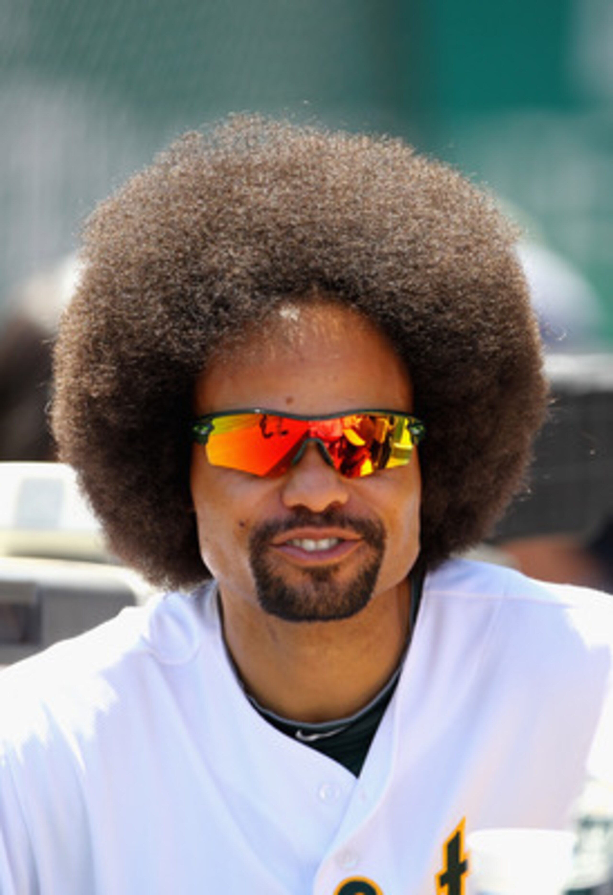 OAKLAND, CA - MAY 02:  Coco Crisp #4 of the Oakland Athletics stands in the dugout before their game against the Texas Rangers at Oakland-Alameda County Coliseum on May 2, 2011 in Oakland, California.  (Photo by Ezra Shaw/Getty Images)