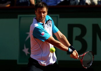 PARIS, FRANCE - JUNE 01:  Robin Soderling of Sweden hits a backhand during the men's singles quarterfinal match between Rafael Nadal of Spain and Robin Soderling of Sweden on day eleven of the French Open at Roland Garros on June 1, 2011 in Paris, France.