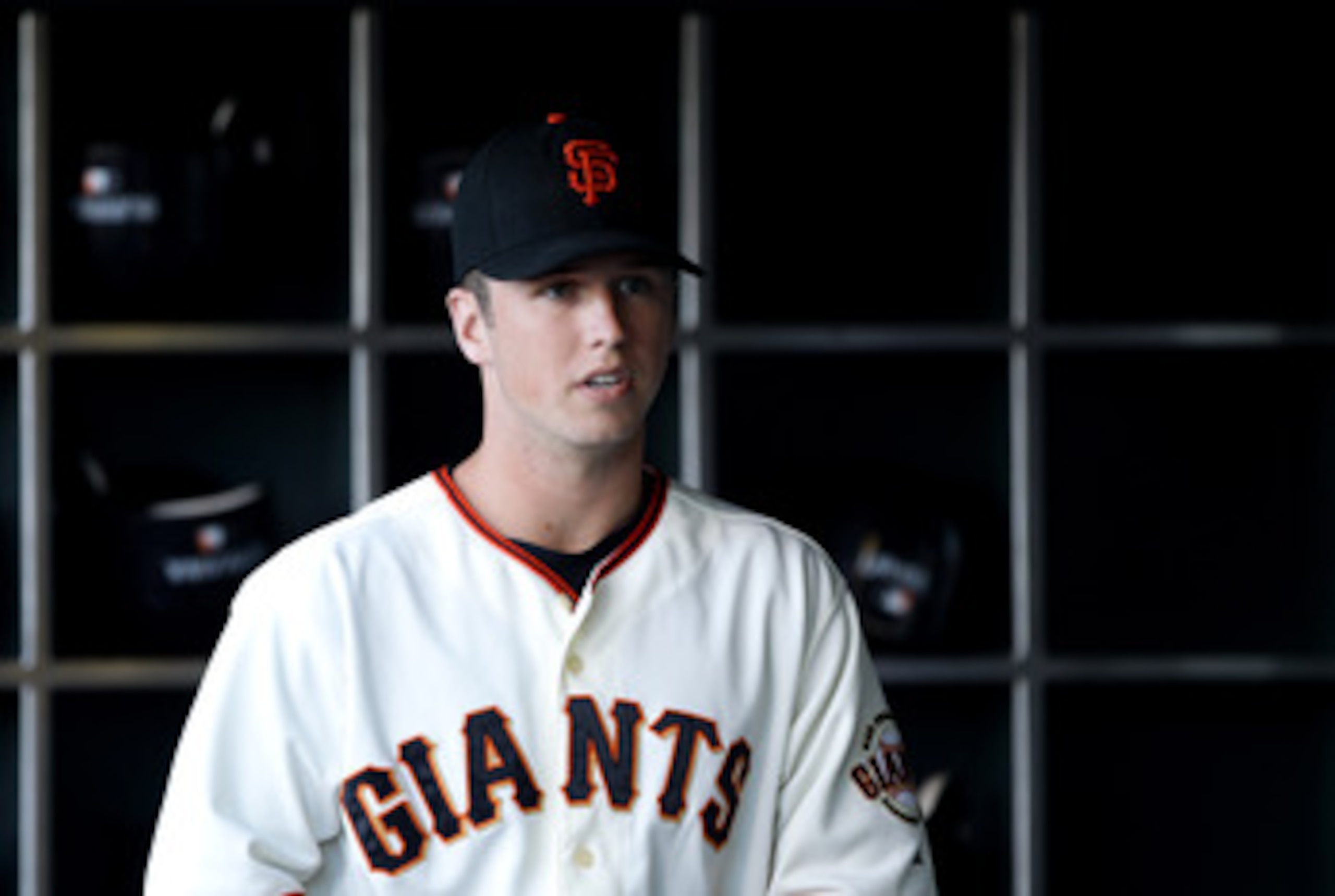 SAN FRANCISCO - JULY 15:  Buster Posey #28 of the San Francisco Giants stands in the dugout before their game against the New York Mets at AT&T Park on July 15, 2010 in San Francisco, California.  (Photo by Ezra Shaw/Getty Images)