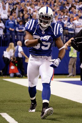 INDIANAPOLIS, IN - JANUARY 08: Pierre Garcon #85 of the Indianapolis Colts celebrates after he scored on a 57-yard touchdown reception in the seocnd quarter against the New York Jets during their 2011 AFC wild card playoff game at Lucas Oil Stadium on Ja INDIANAPOLIS, IN - JANUARY 08: Pierre Garcon #85 of the Indianapolis Colts celebrates after he scored on a 57-yard touchdown reception in the seocnd quarter against the New York Jets during their 2011 AFC wild card playoff game at Lucas Oil Stadium on Ja