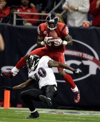 HOUSTON, TX - DECEMBER 13: Wide receiver Andre Johnson #80 of the Houston Texans scores on a pass as he goes over safety Ed Reed #20 of the Baltimore Ravens in the second quarter at Reliant Stadium on December 13, 2010 in Houston, Texas. (Photo by Bob L HOUSTON, TX - DECEMBER 13: Wide receiver Andre Johnson #80 of the Houston Texans scores on a pass as he goes over safety Ed Reed #20 of the Baltimore Ravens in the second quarter at Reliant Stadium on December 13, 2010 in Houston, Texas. (Photo by Bob L