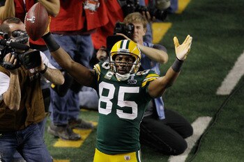 ARLINGTON, TX - FEBRUARY 06: Greg Jennings #85 of the Green Bay Packers celebrates scoring a fourth quarter touchdown against the Pittsburgh Steelers during Super Bowl XLV at Cowboys Stadium on February 6, 2011 in Arlington, Texas. (Photo by Rob Carr/G ARLINGTON, TX - FEBRUARY 06: Greg Jennings #85 of the Green Bay Packers celebrates scoring a fourth quarter touchdown against the Pittsburgh Steelers during Super Bowl XLV at Cowboys Stadium on February 6, 2011 in Arlington, Texas. (Photo by Rob Carr/G
