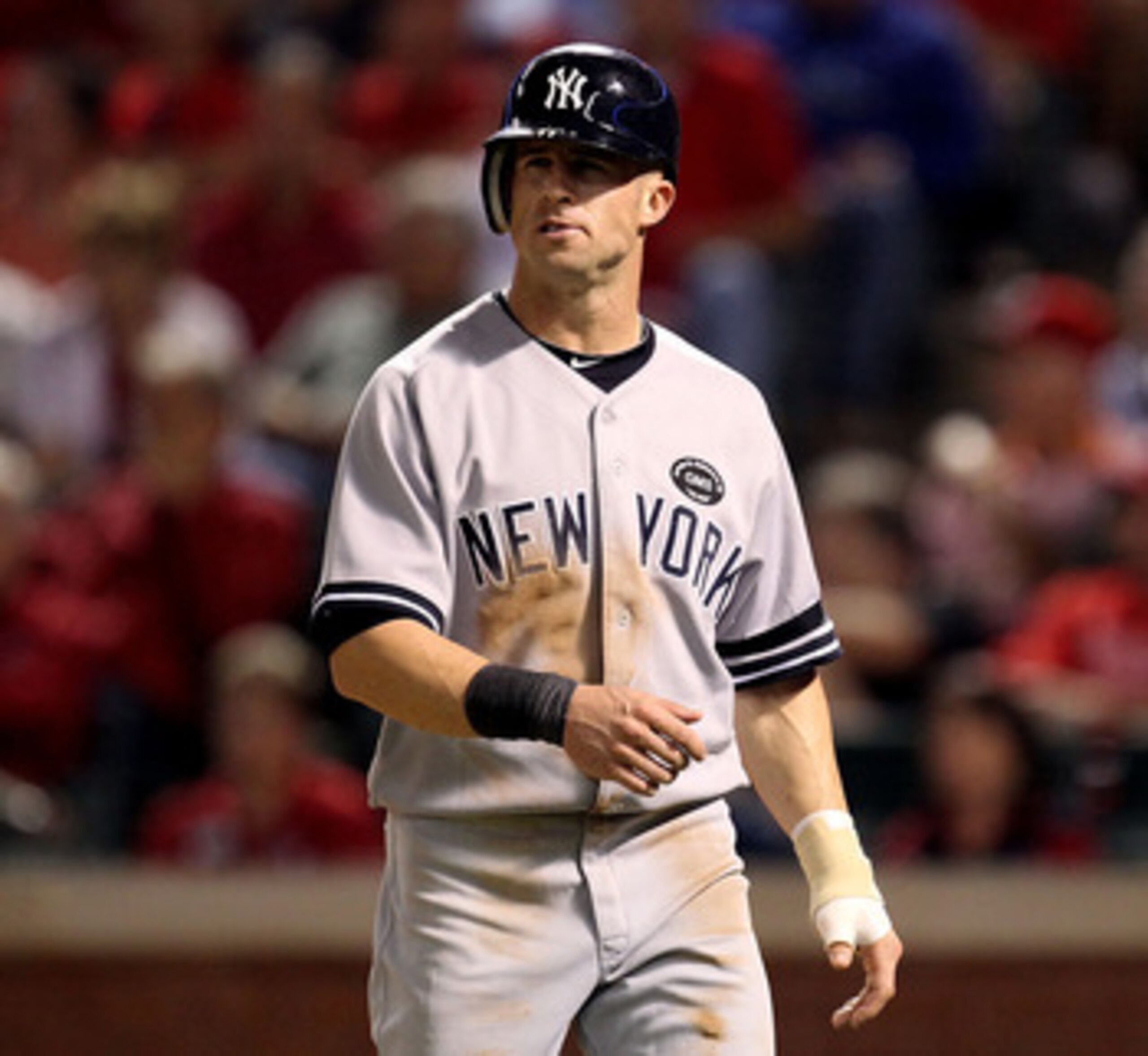 ARLINGTON, TX - OCTOBER 15:  Brett Gardner #11 of the New York Yankees looks on after he scored on a RBI double by Derek Jeter #2 in the top of the eighth inning against the Texas Rangers in Game One of the ALCS during the 2010 MLB Playoffs at Rangers Bal