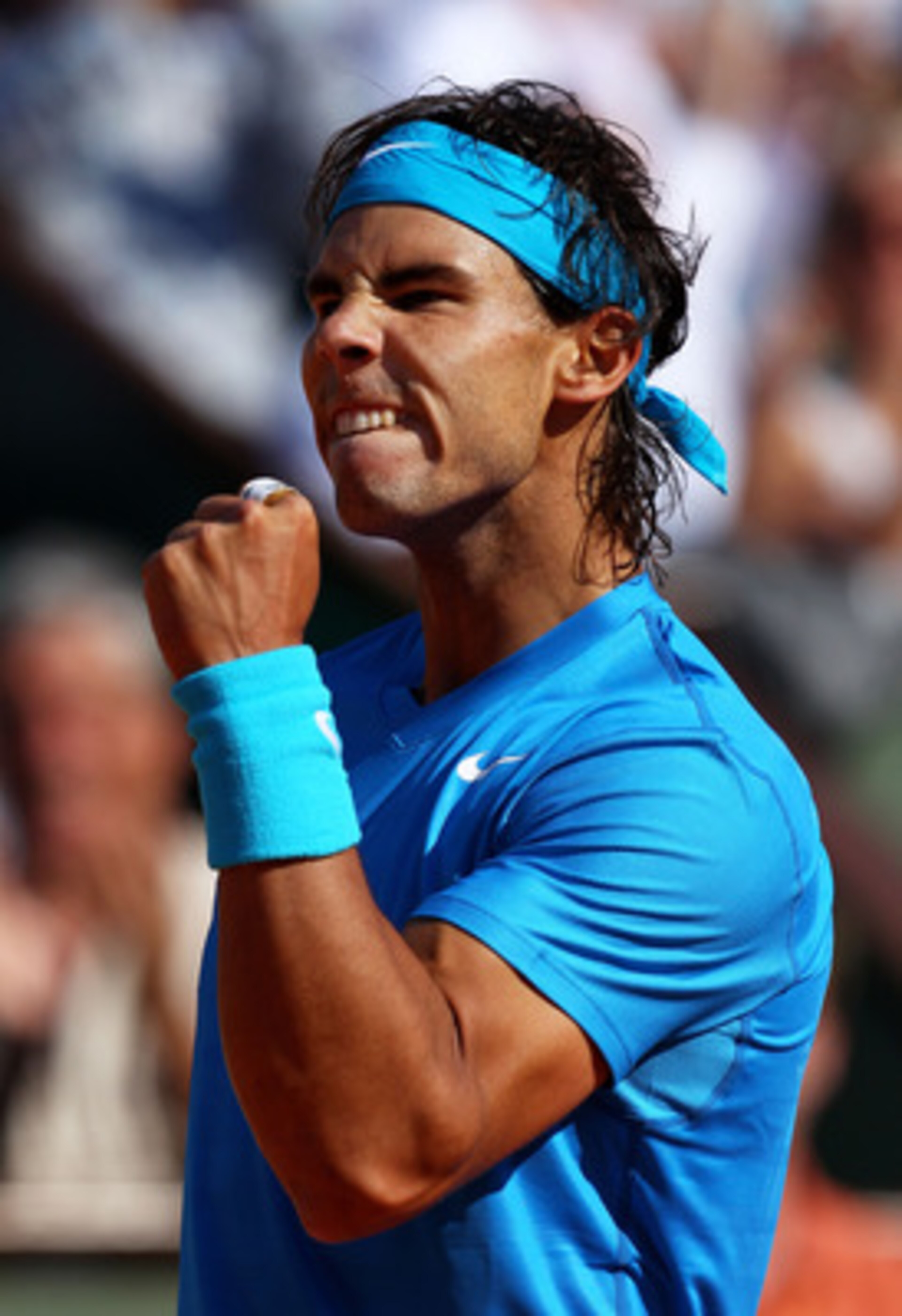 PARIS, FRANCE - JUNE 01: Rafael Nadal of Spain celebrates a point during the men's singles quarterfinal match between Rafael Nadal of Spain and Robin Soderling of Sweden on day eleven of the French Open at Roland Garros on June 1, 2011 in Paris, France. PARIS, FRANCE - JUNE 01: Rafael Nadal of Spain celebrates a point during the men's singles quarterfinal match between Rafael Nadal of Spain and Robin Soderling of Sweden on day eleven of the French Open at Roland Garros on June 1, 2011 in Paris, France.