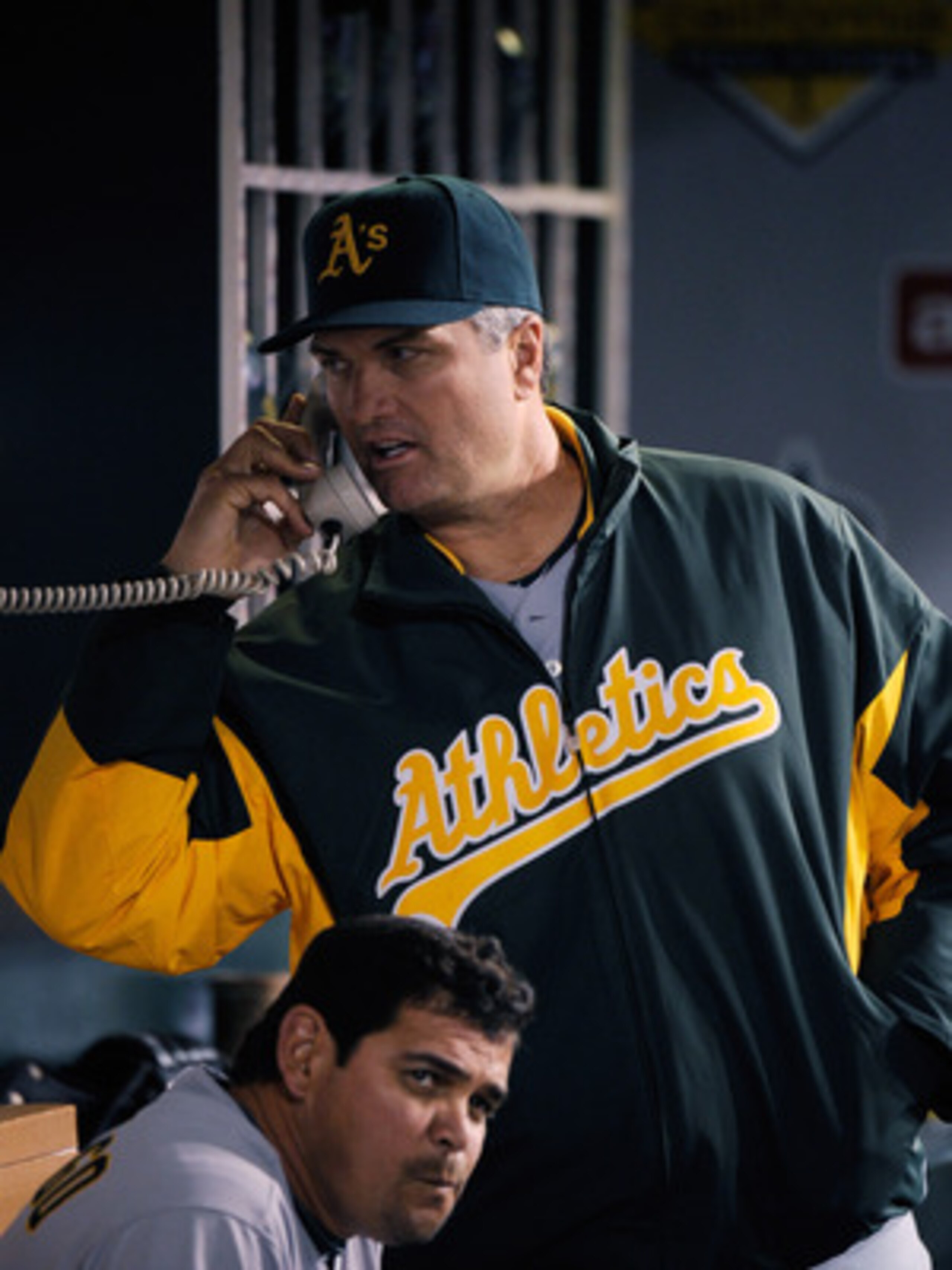 ANAHEIM, CA - MAY 25:  Manager Bob Geren (R) of the Oakland Athletics calls the bull pen during the baseball game against the Los Angeles Angels of Anaheim at Angel Stadium of Anaheim on May 25, 2011 in Anaheim, California. (Photo by Kevork Djansezian/Get
