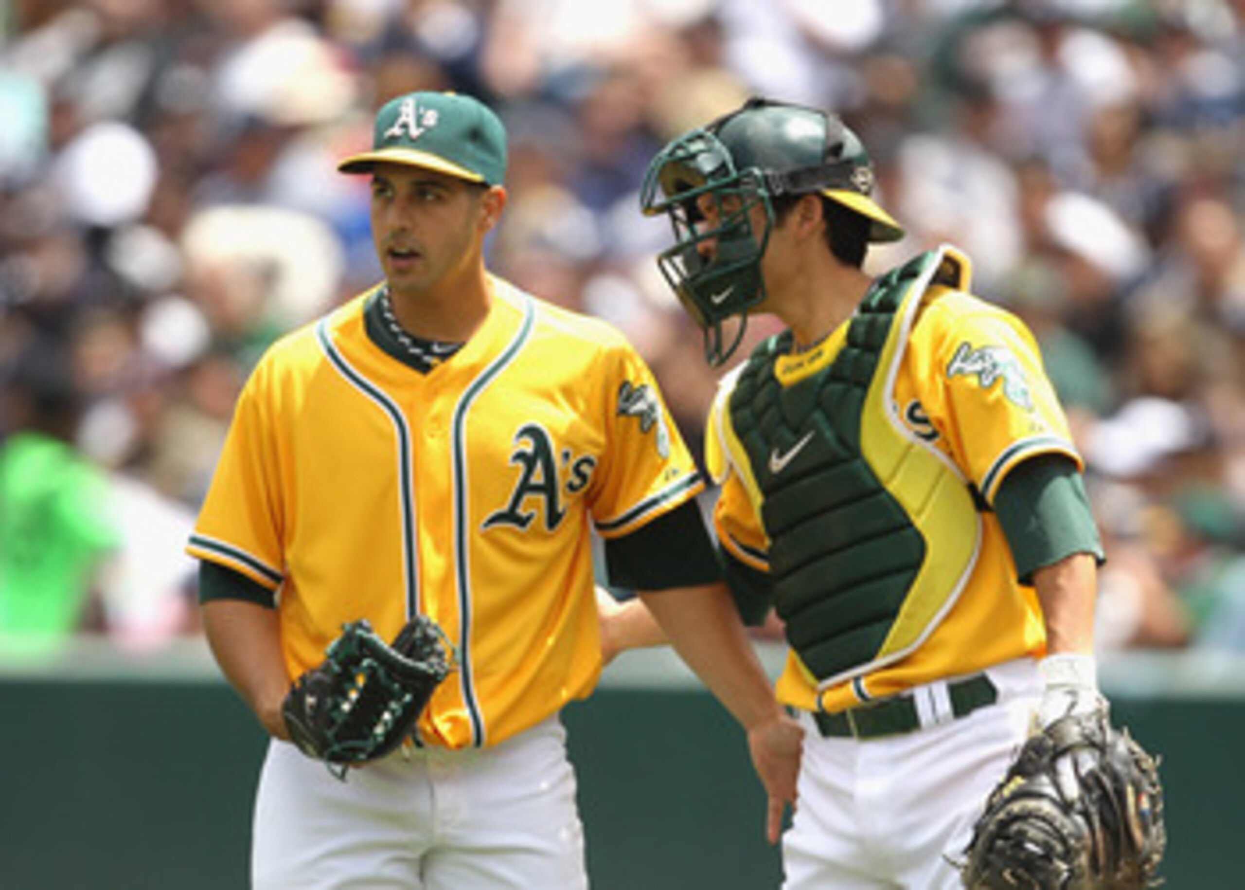 OAKLAND, CA - JUNE 01:  Kurt Suzuki #8 talks to Gio Gonzalez #47 of the Oakland Athletics after Gonzalez hit Derek Jeter #2 of the New York Yankees at Oakland-Alameda County Coliseum on June 1, 2011 in Oakland, California.  (Photo by Ezra Shaw/Getty Image
