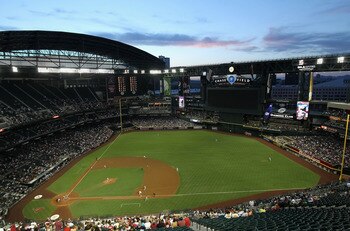 PHOENIX, AZ - JUNE 03:  General view of action as starting pitcher Josh Collmenter #55 of the Arizona Diamondbacks pitches against the Washington Nationals during the Major League Baseball game at Chase Field on June 3, 2011 in Phoenix, Arizona.  (Photo b