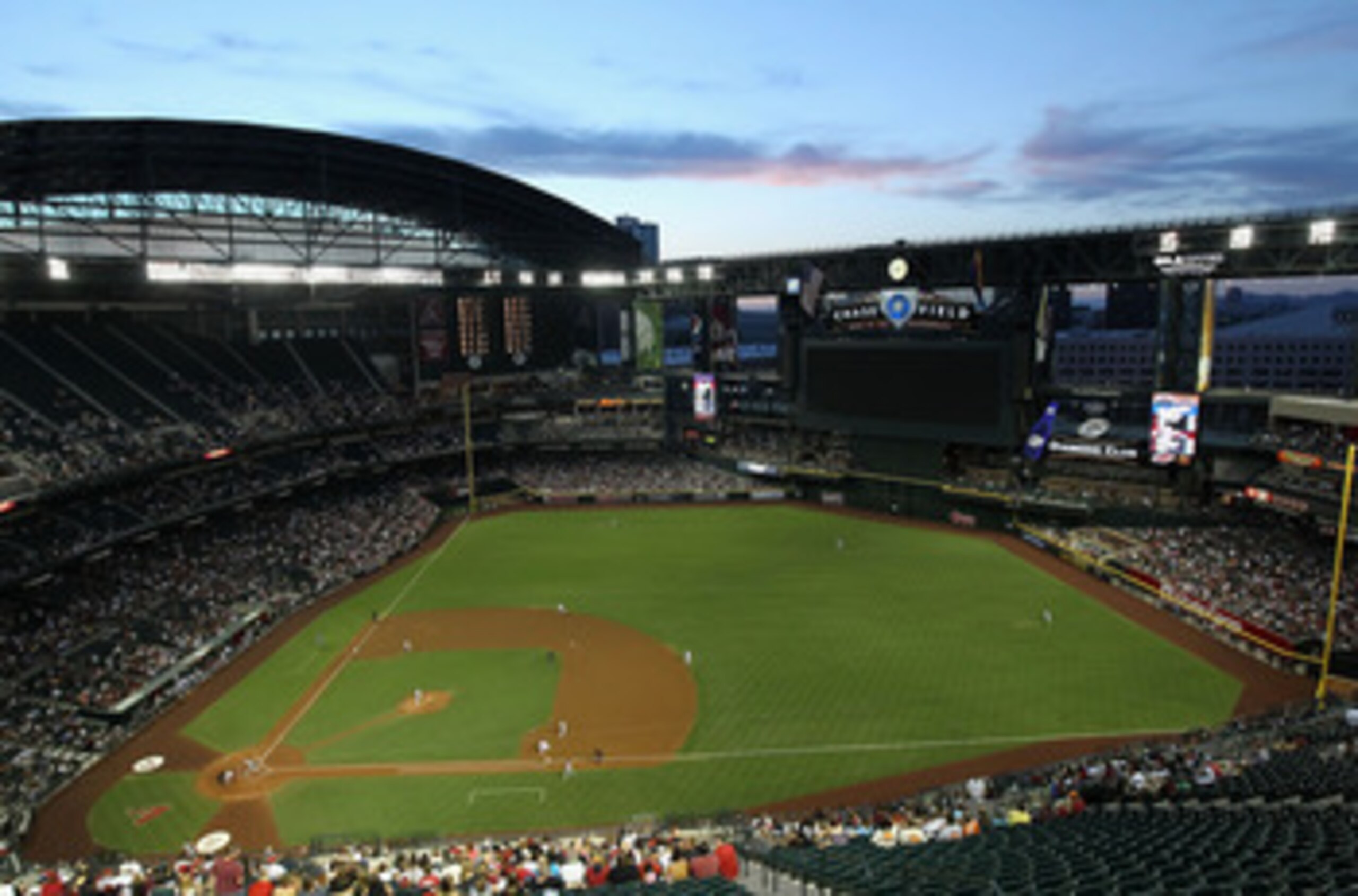 PHOENIX, AZ - JUNE 03:  General view of action as starting pitcher Josh Collmenter #55 of the Arizona Diamondbacks pitches against the Washington Nationals during the Major League Baseball game at Chase Field on June 3, 2011 in Phoenix, Arizona.  (Photo b