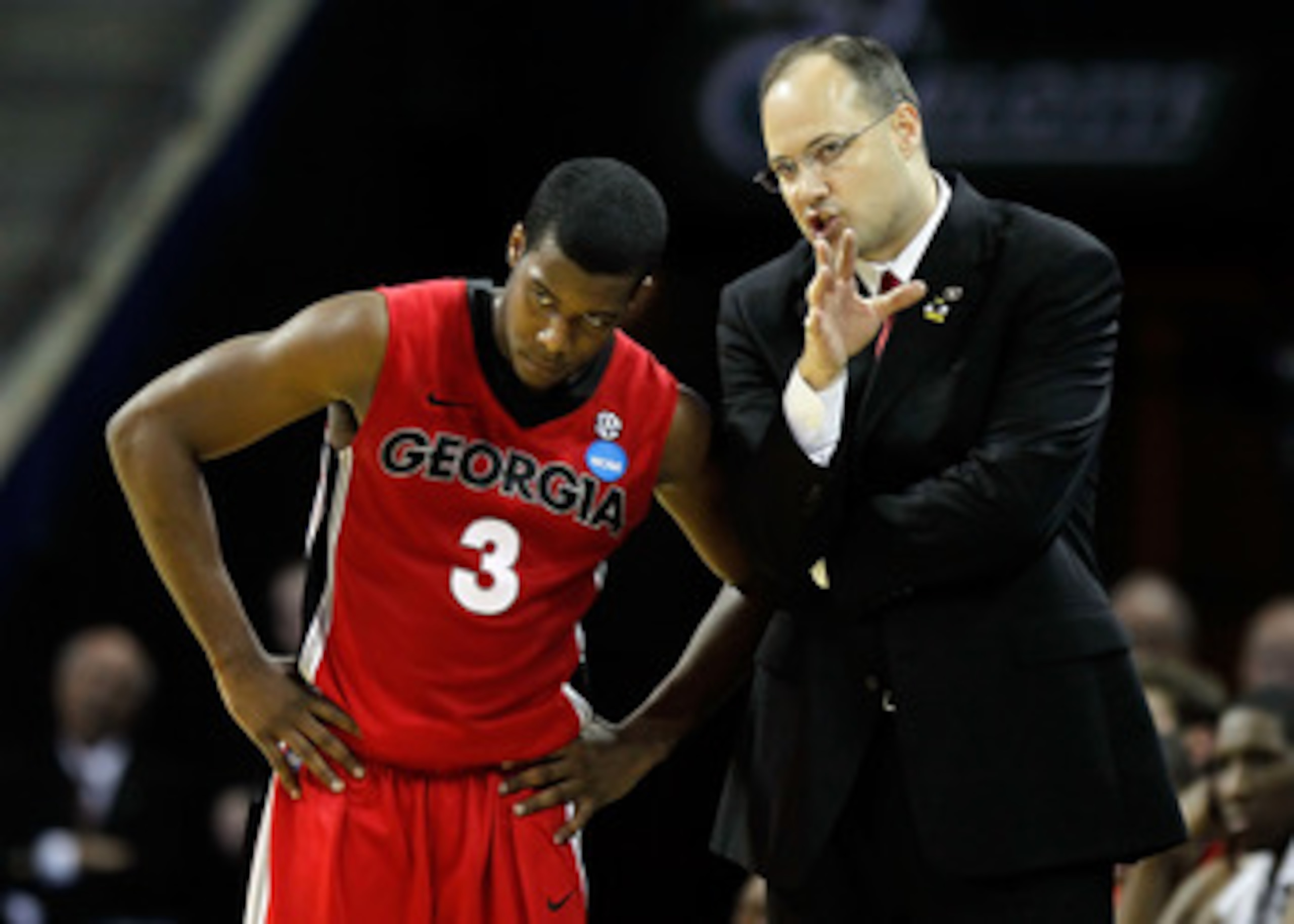 CHARLOTTE, NC - MARCH 18:  Head coach Mark Fox of the Georgia Bulldogs talks with Dustin Ware #3 in the first half while taking on the Washington Huskies during the second round of the 2011 NCAA men's basketball tournament at Time Warner Cable Arena on Ma