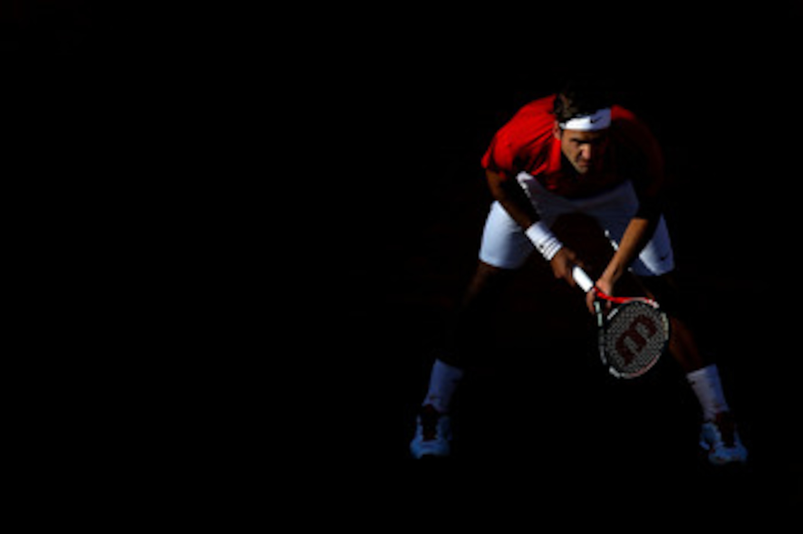 PARIS, FRANCE - MAY 31:  Roger Federer of Switzerland awaits a serve during the men's singles quarterfinal match between Gael Monfils of France and Roger Federer of Switzerland on day ten of the French Open at Roland Garros on May 31, 2011 in Paris, Franc