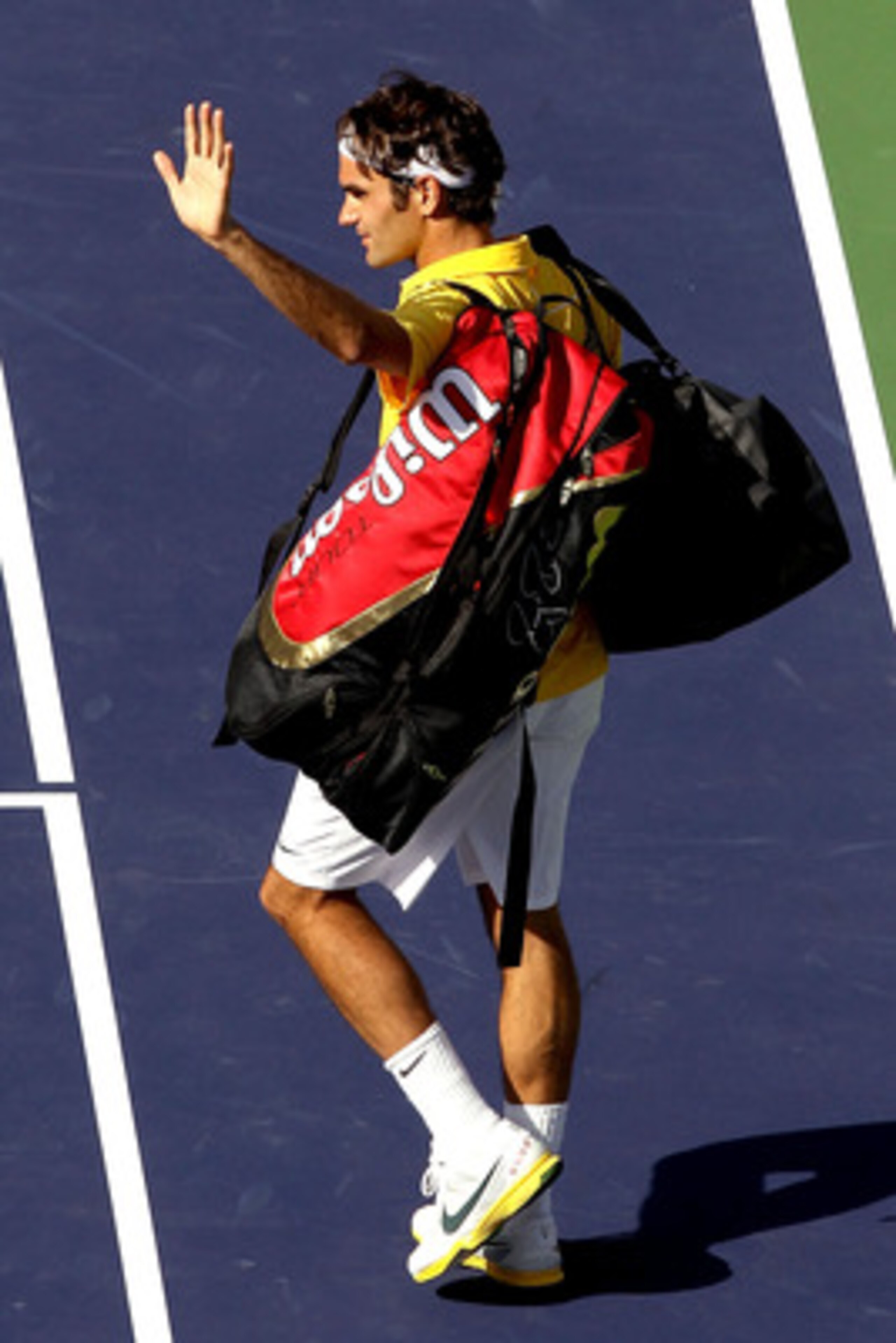 INDIAN WELLS, CA - MARCH 19:  Roger Federer of Switzerland leaves the court after loosing to Novak Djokovic of Serbia during the semifinals of the BNP Paribas Open at the Indian Wells Tennis Garden on March 19, 2011 in Indian Wells, California.  (Photo by