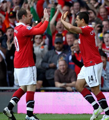 MANCHESTER, ENGLAND - MAY 08:  Javier Hernandez of Manchester United celebrates scoring the opening goal with team mate Wayne Rooney (L) during the Barclays Premier League match between Manchester United and Chelsea at Old Trafford on May 8, 2011 in Manch