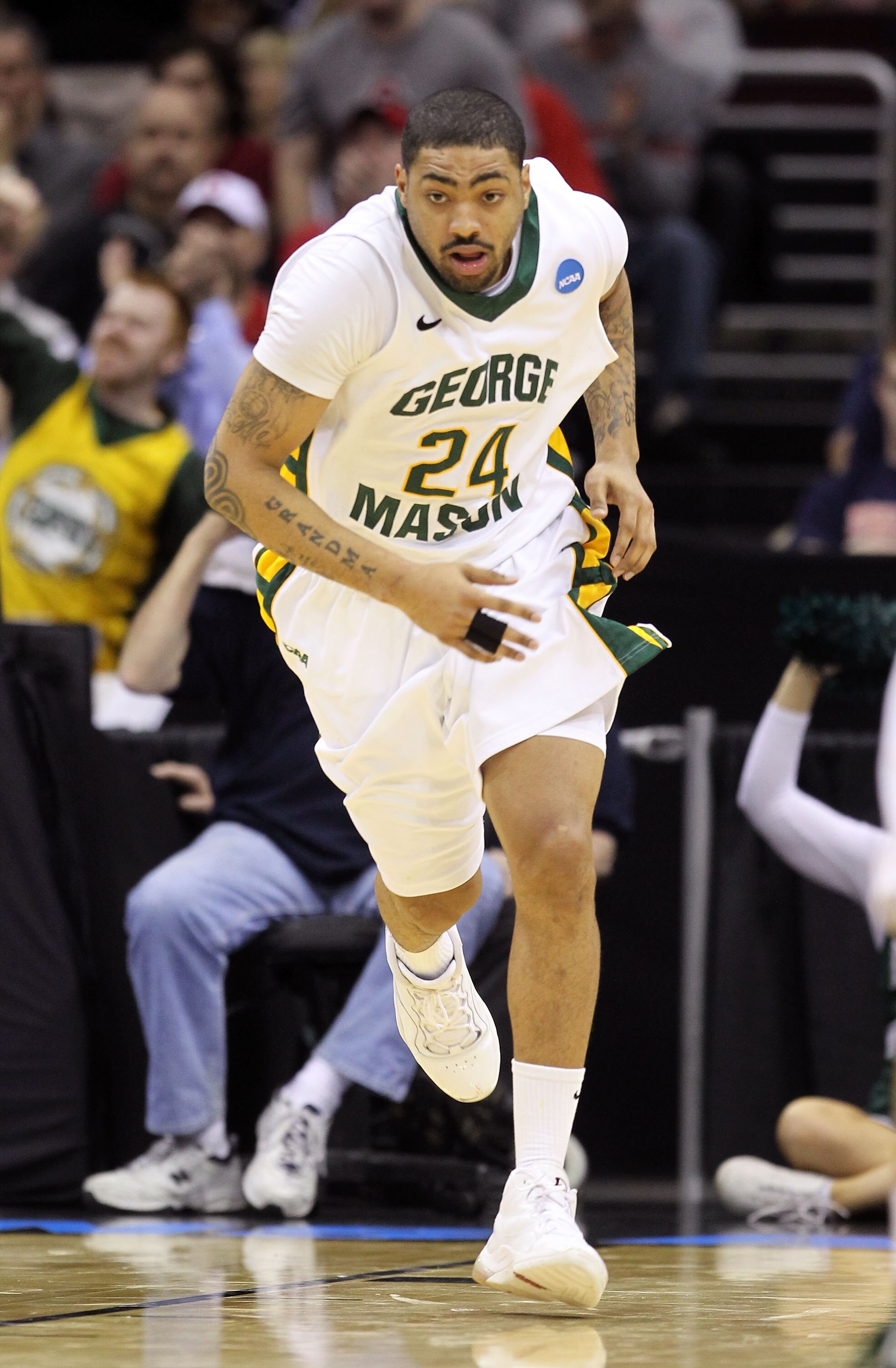 CLEVELAND, OH - MARCH 18: Ryan Pearson #24 of the George Mason Patriots runs up court after a play against the Villanova Wildcats during the second round of the 2011 NCAA men's basketball tournament at Quicken Loans Arena on March 18, 2011 in Cleveland, O