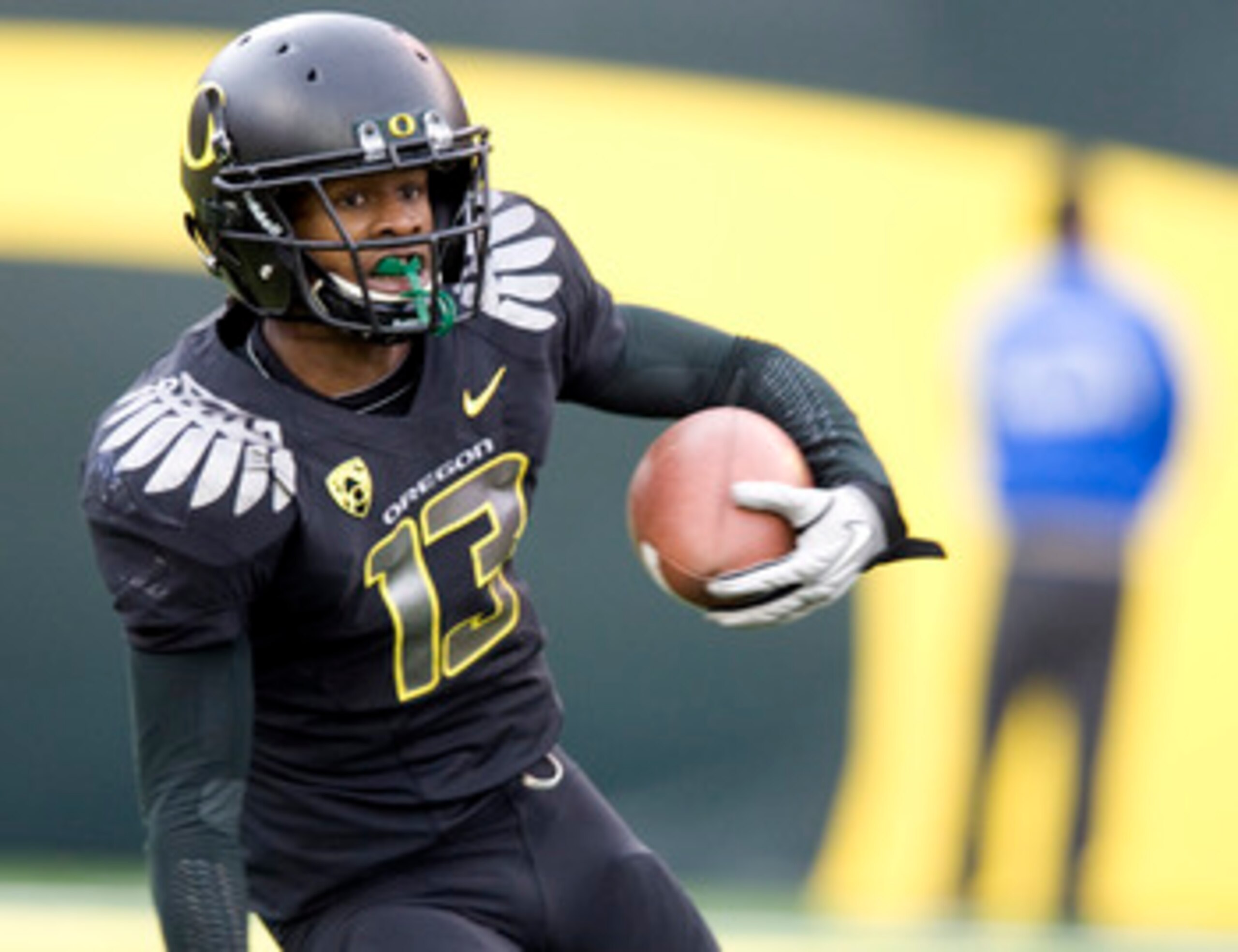 EUGENE, OR - NOVEMBER 6: Cornerback Cliff Harris #13 of the Oregon Ducks runs back a punt in the fourth quarter of the game against the Washington Huskies at Autzen Stadium on November 6, 2010 in Eugene, Oregon. The Ducks won the game 53-16. (Photo by Ste EUGENE, OR - NOVEMBER 6: Cornerback Cliff Harris #13 of the Oregon Ducks runs back a punt in the fourth quarter of the game against the Washington Huskies at Autzen Stadium on November 6, 2010 in Eugene, Oregon. The Ducks won the game 53-16. (Photo by Ste