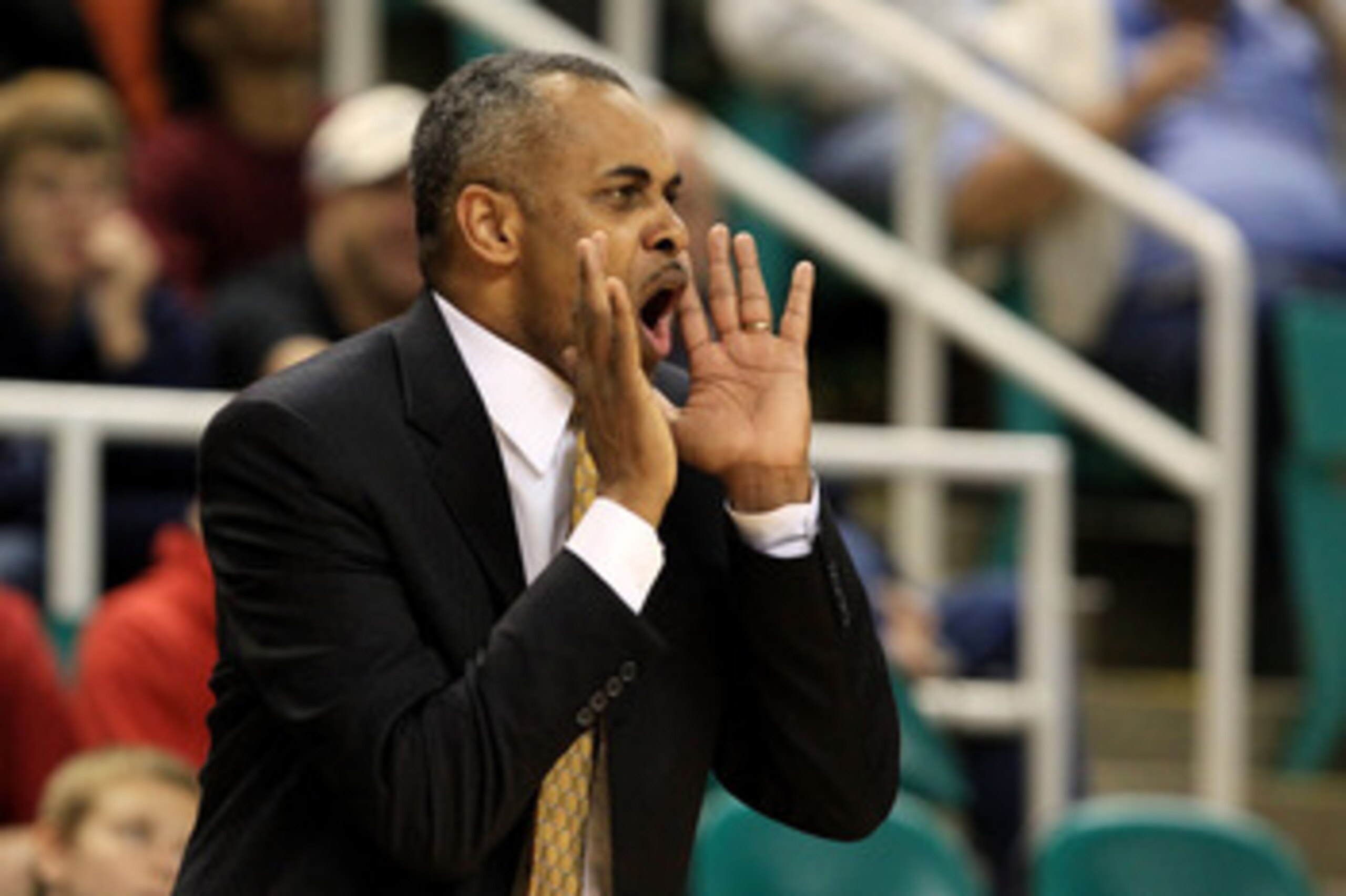 GREENSBORO, NC - MARCH 10:  Head coach Paul Hewitt of the Georgia Tech Yellow Jackets communicates with his team during the first half of the game against the Virginia Tech Hokies in the first round of the 2011 ACC men's basketball tournament at the Green
