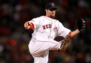BOSTON - OCTOBER 24:  Eric Gagne #83 of the Boston Red Sox pitches in the ninth inning of Game One of the 2007 Major League Baseball World Series against Colorado Rockies at Fenway Park on October 24, 2007 in Boston, Massachusetts.  (Photo by Jed Jacobsoh