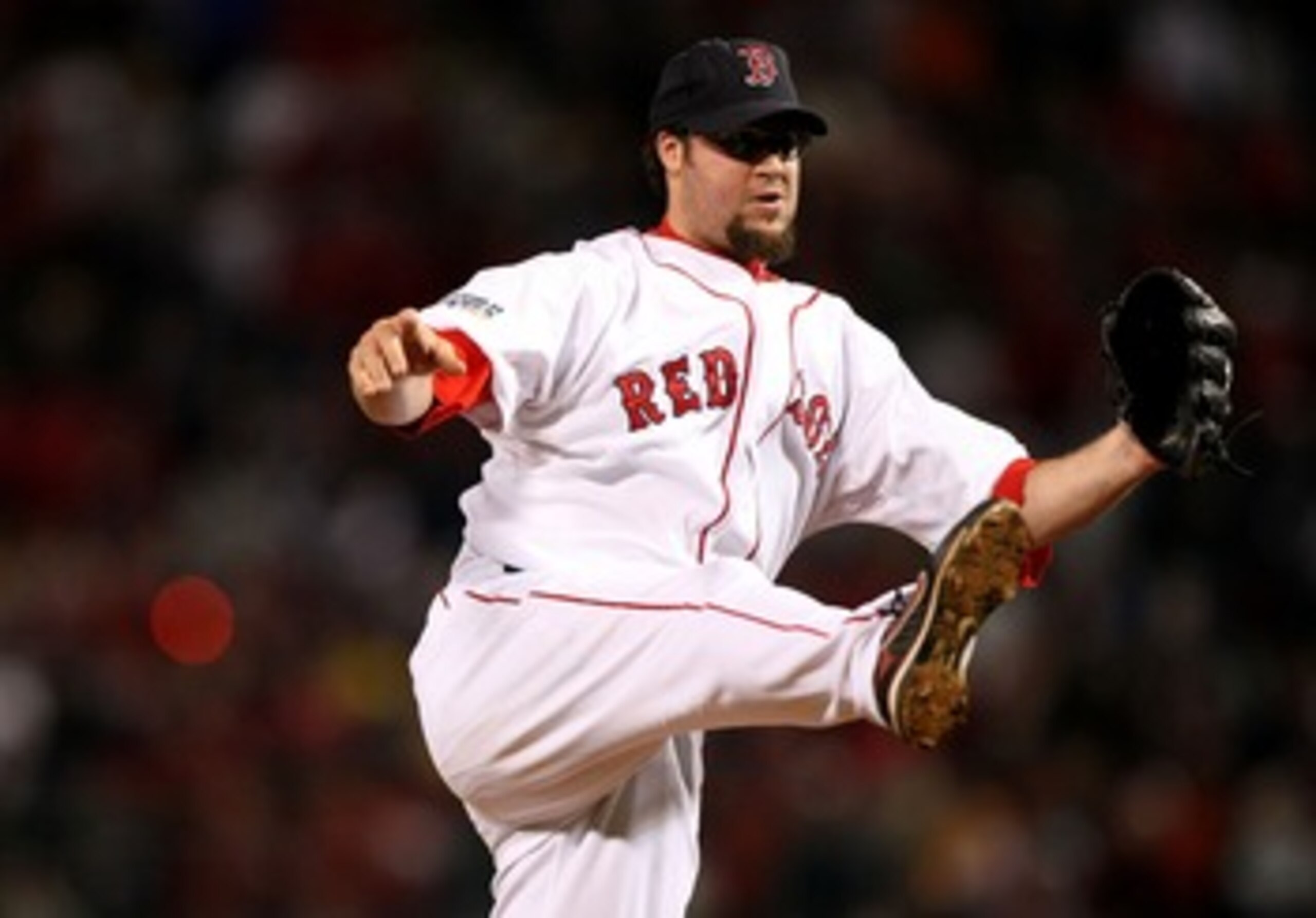 BOSTON - OCTOBER 24:  Eric Gagne #83 of the Boston Red Sox pitches in the ninth inning of Game One of the 2007 Major League Baseball World Series against Colorado Rockies at Fenway Park on October 24, 2007 in Boston, Massachusetts.  (Photo by Jed Jacobsoh