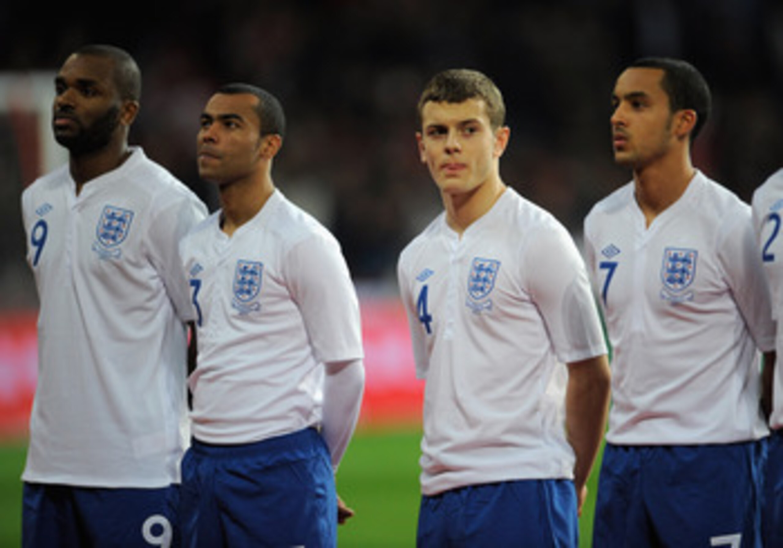 COPENHAGEN, DENMARK - FEBRUARY 09: Jack Wilshere of England looks on with team mates Darren Bent, Ashley Cole and Theo Walcott before the international friendly match between Denmark and England at Parken Stadium on February 9, 2011 in Copenhagen, . (Pho COPENHAGEN, DENMARK - FEBRUARY 09: Jack Wilshere of England looks on with team mates Darren Bent, Ashley Cole and Theo Walcott before the international friendly match between Denmark and England at Parken Stadium on February 9, 2011 in Copenhagen, . (Pho