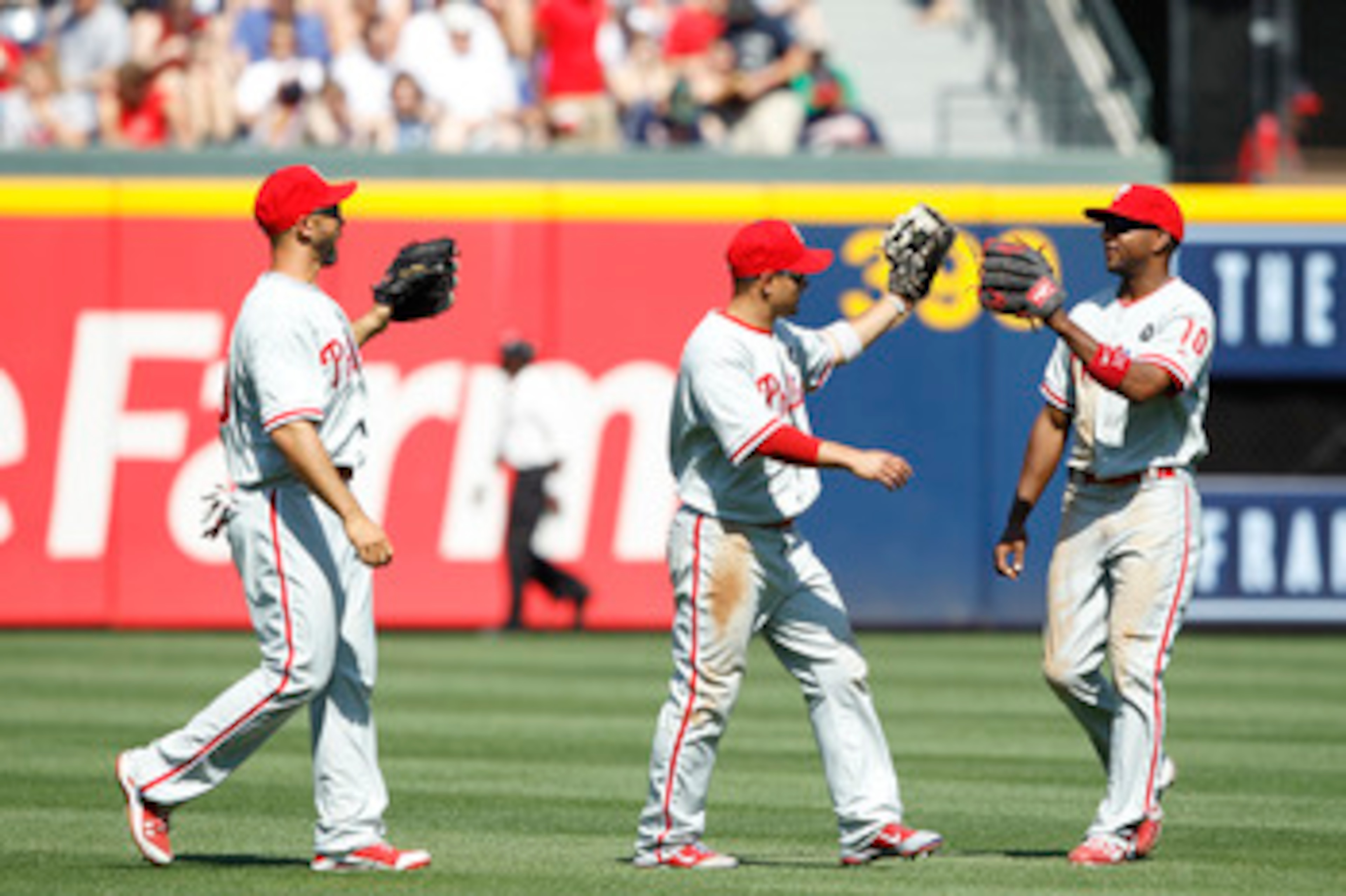 ATLANTA, GA - APRIL 10: Shane Victorino #8, Ben Francisco #10 and Raul Ibanez #29 of the Philadelphia Phillies celebrate after the game against the Atlanta Braves at Turner Field on April 10, 2011 in Atlanta, Georgia. The Phillies won 3-0. (Photo by Joe R ATLANTA, GA - APRIL 10: Shane Victorino #8, Ben Francisco #10 and Raul Ibanez #29 of the Philadelphia Phillies celebrate after the game against the Atlanta Braves at Turner Field on April 10, 2011 in Atlanta, Georgia. The Phillies won 3-0. (Photo by Joe R