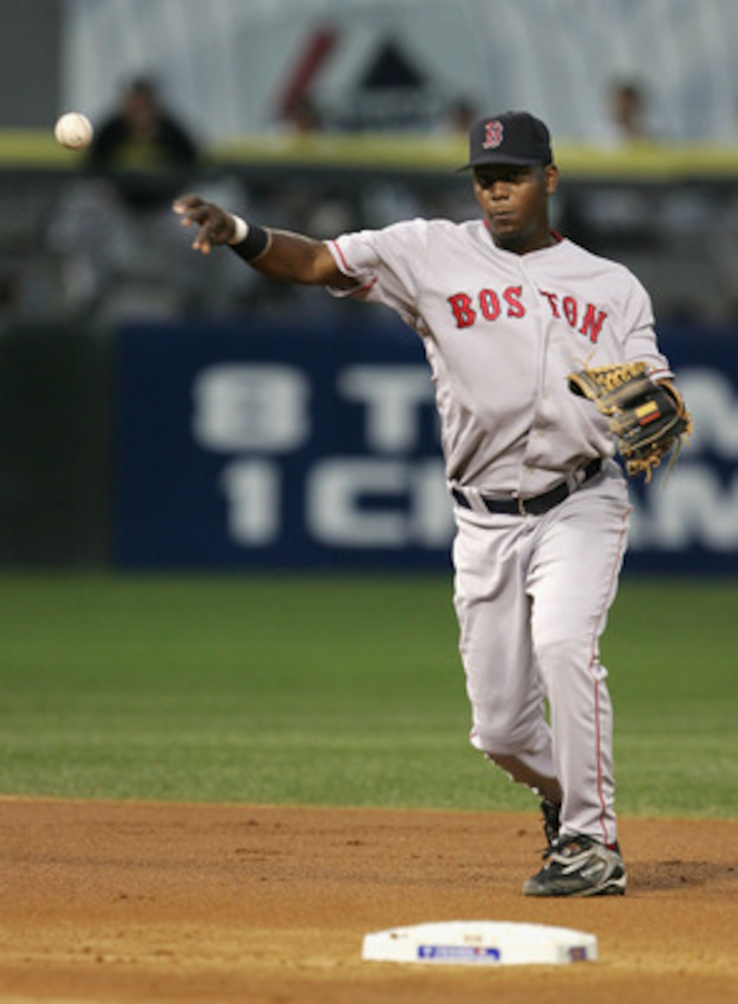 CHICAGO - OCTOBER 05:  Shortstop Edgar Renteria #3 of the Boston Red Sox throws to first base for an out against the Chicago White Sox during the first inning of Game Two of the American League Division Series at U.S. Celluar Field on October 5, 2005 in C