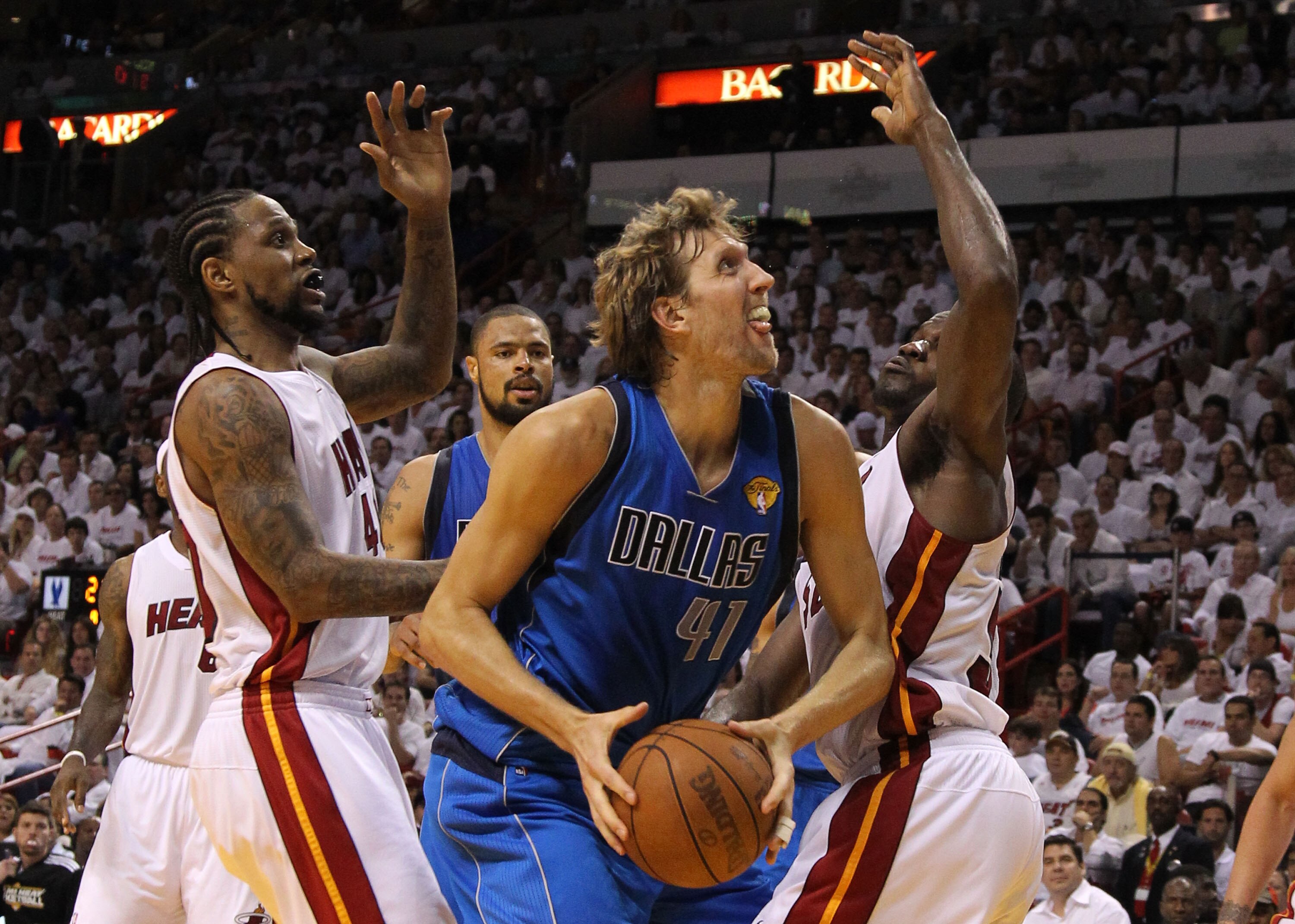 MIAMI, FL - JUNE 02:  Dirk Nowitzki #41 of the Dallas Mavericks drives against Joel Anthony #50 and Udonis Haslem #40 of the Miami Heat in Game Two of the 2011 NBA Finals at American Airlines Arena on June 2, 2011 in Miami, Florida. NOTE TO USER: User exp
